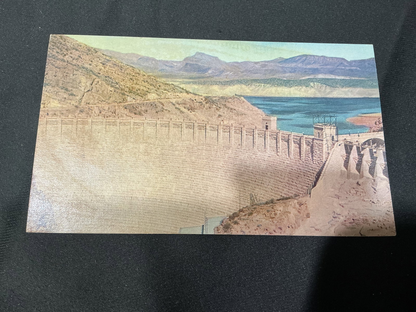 1939 Roosevelt Dam Union Oil Color Postcard: Vintage Union Oil Company color postcard featuring Roosevelt Dam east of Phoenix, Arizona. Part of the Natural Color Photographic Scenes of the West series, copyright 1939. Unused example with