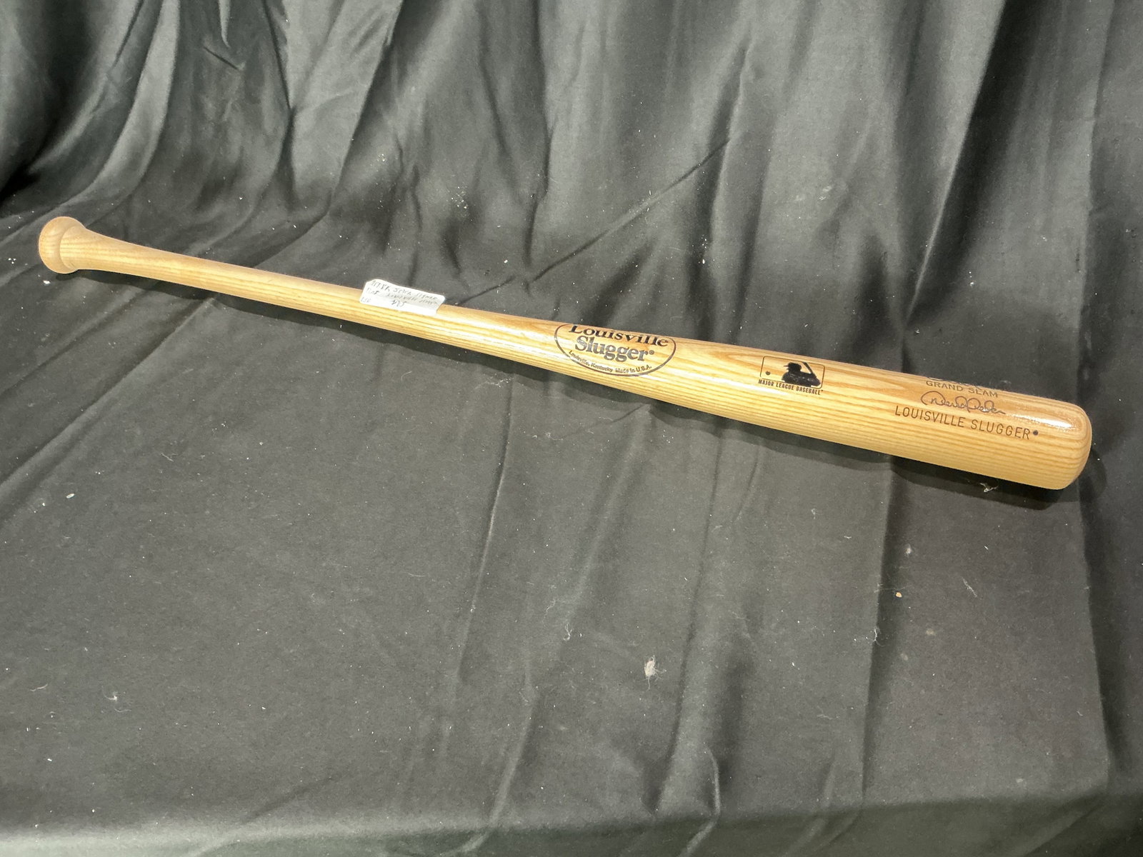Louisville Slugger Grand Slam Display Bat: Louisville Slugger Grand Slam commemorative wooden baseball bat with printed player-style signature markings and Major League Baseball branding. Display-friendly sports memorabilia piece with strong