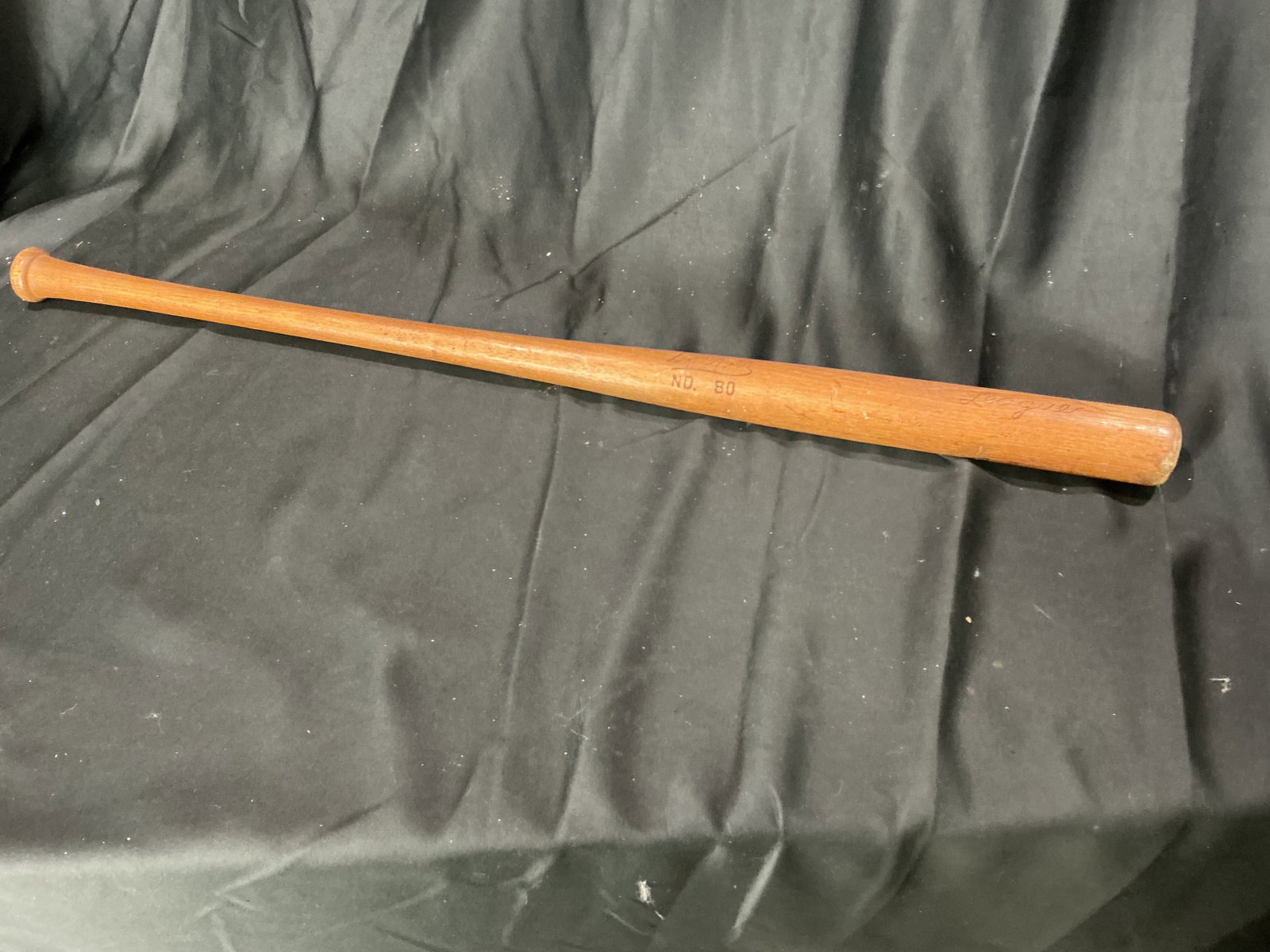Vintage No. 80 Baseball Bat: Vintage wooden baseball bat marked No. 80. Classic baseball display piece with strong vintage sporting appeal for memorabilia collectors. Estimated shipping $20-$40.