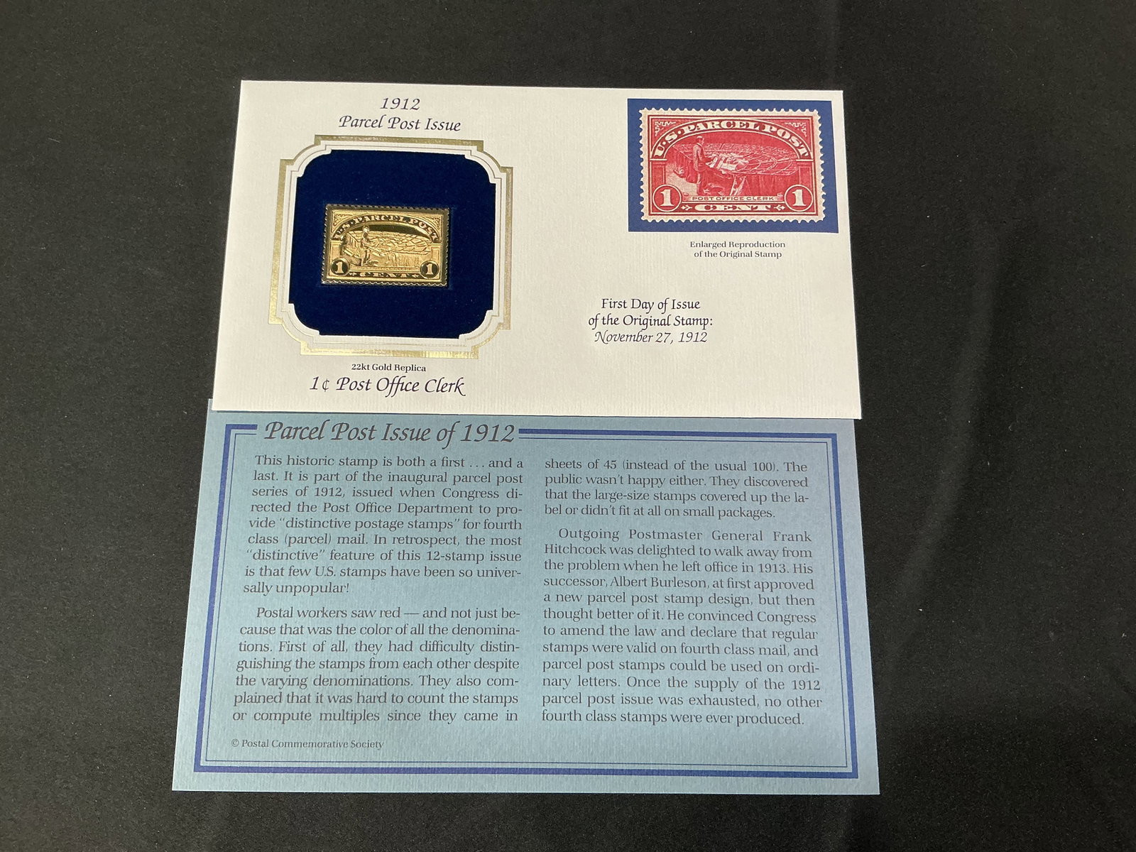1912 Parcel Post Gold Replica: Commemorative 22kt gold replica stamp honoring the 1912 Parcel Post Issue featuring the 1 Cent Post Office Clerk design. Includes presentation card with enlarged stamp image and historical