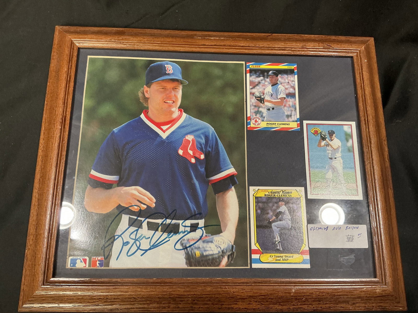 Roger Clemens Signed Framed Display: First appearance in this auction featuring a framed Roger Clemens display with large signed photo, multiple baseball cards, and commemorative presentation. Celebrates the legendary Boston Red Sox