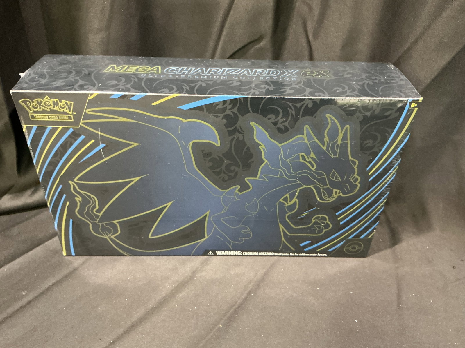 Pokemon Mega Charizard X UPC Sealed: Pokemon Mega Charizard X EX Ultra Premium Collection featuring Charizard-themed accessories, promo cards, booster packs, and premium display packaging. Performed well in our last auction and returns