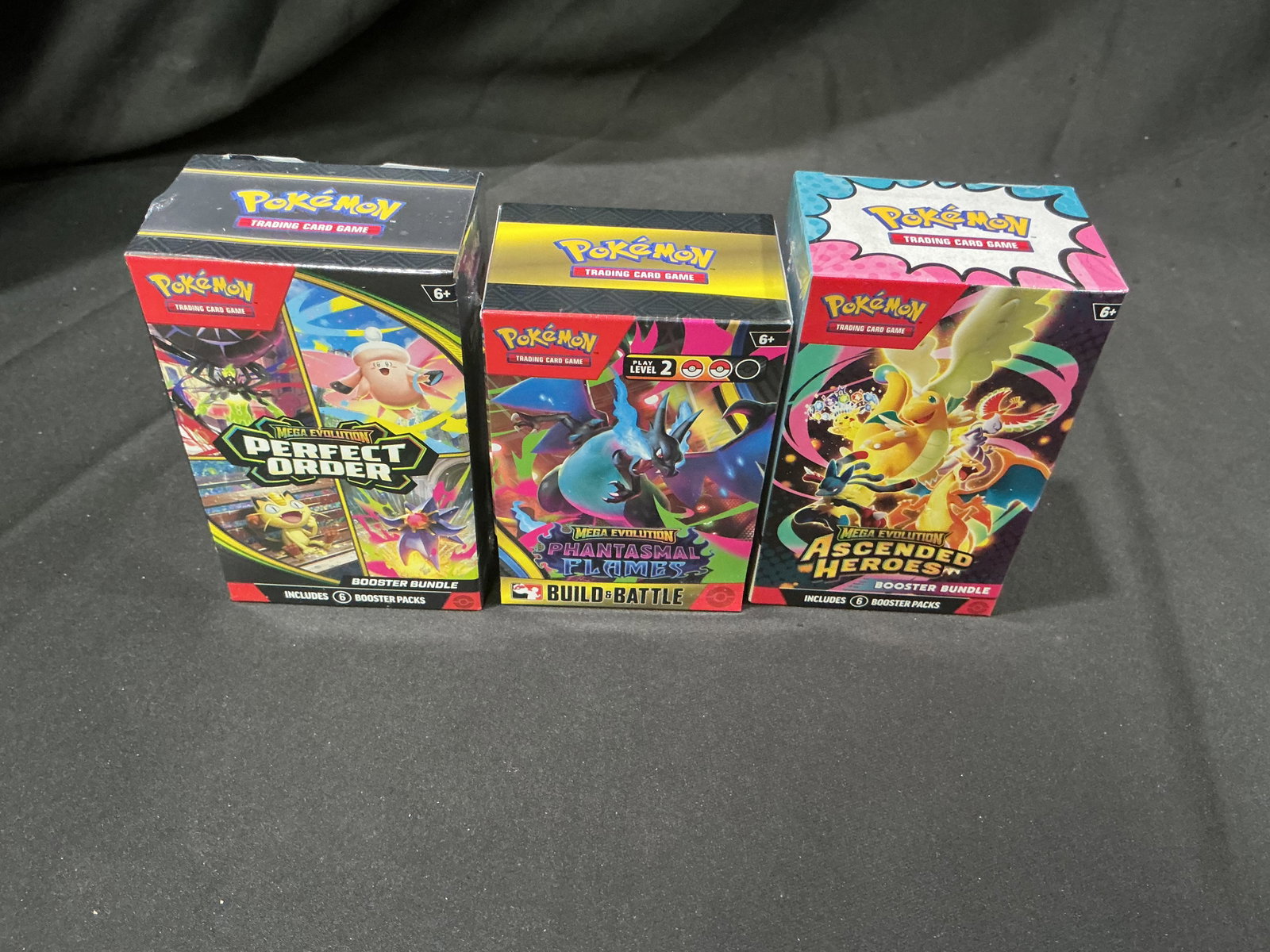 Mega Evolution Booster Bundle Trio: Back again, this factory sealed Pokemon Mega Evolution trio includes a Perfect Order Booster Bundle, Phantasmal Flames Build & Battle Box, and Ascended Heroes Booster Bundle. Another opportunity to ac
