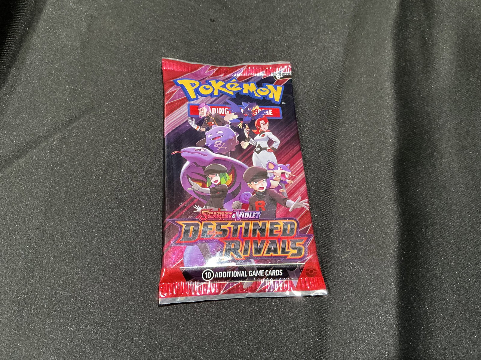 Destined Rivals Booster Pack: Back again, this factory sealed Pokemon Scarlet & Violet Destined Rivals booster pack features Team Rocket-themed artwork. Another chance to pick up a modern sealed pack for collectors and
