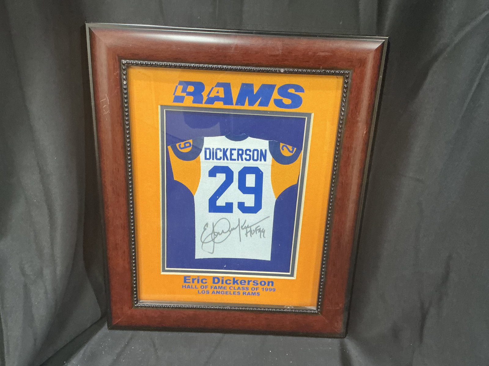 Eric Dickerson Signed Mini Jersey Display: Returning for another opportunity, this framed Los Angeles Rams display features a signed miniature Eric Dickerson #29 jersey with Hall of Fame Class of 1999 recognition. This is a mini jersey display