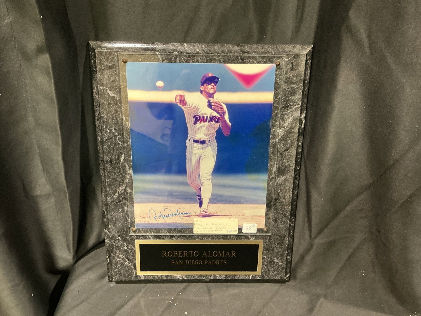 Roberto Alomar Autographed Display Plaque: Featured once more, this Roberto Alomar San Diego Padres display plaque features an autographed color photograph mounted in a marble-look presentation with engraved nameplate. A nice display piece