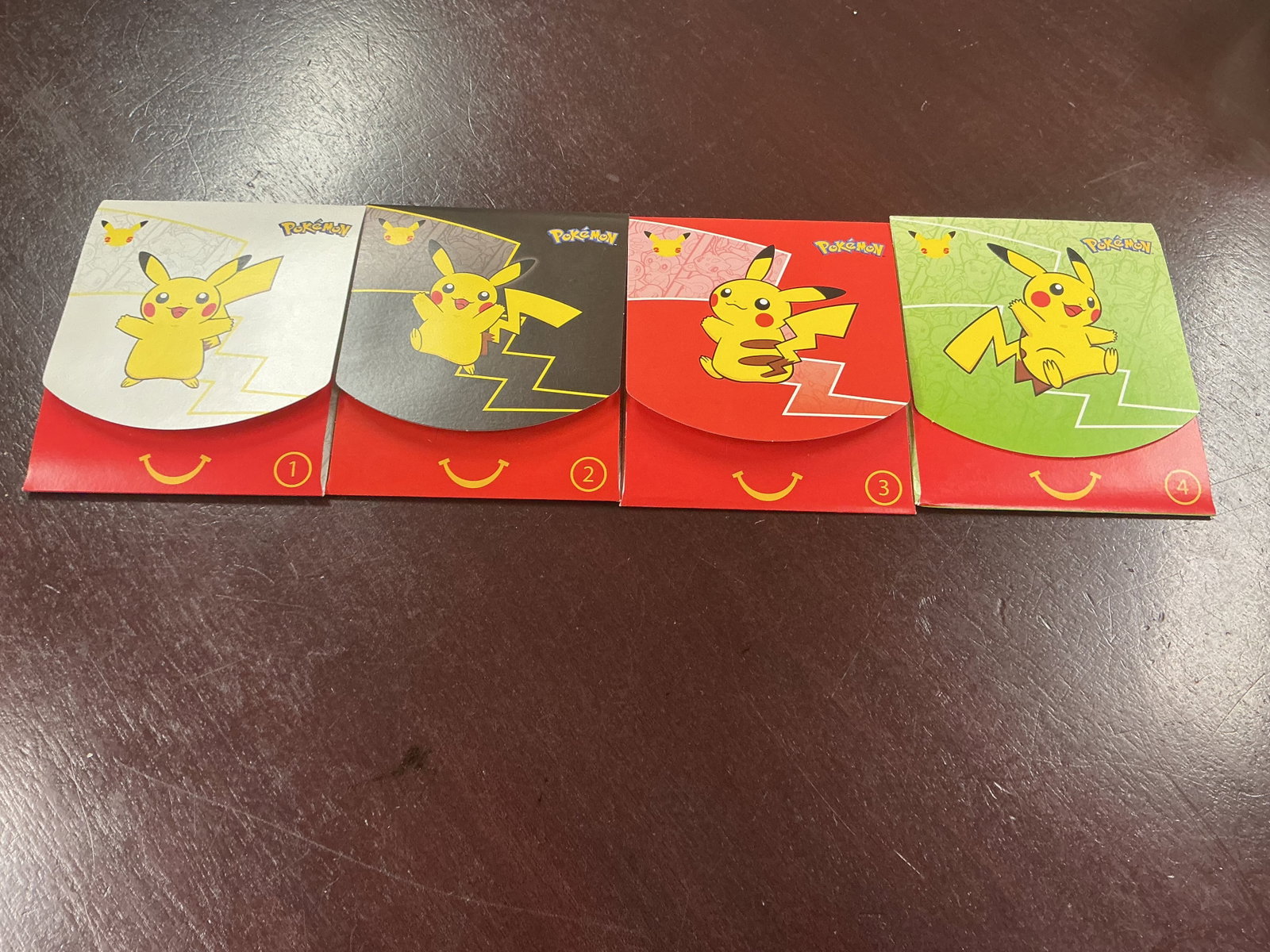 Full Pikachu Happy Meal Box Set: Making its return after a previous appearance, this complete set includes all four Pokemon McDonald's 25th Anniversary Pikachu Happy Meal collectible boxes, numbered 1 through 4. Featuring four