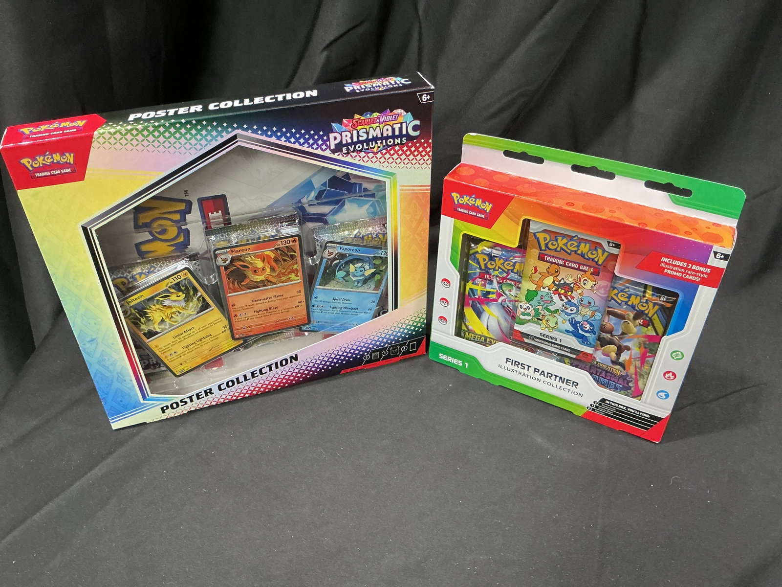 Prismatic Poster & First Partner S1: Making another appearance, this factory sealed Pokemon Prismatic Evolutions Poster Collection is paired with a Series 1 First Partner Illustration Collection, bringing together modern Prismatic