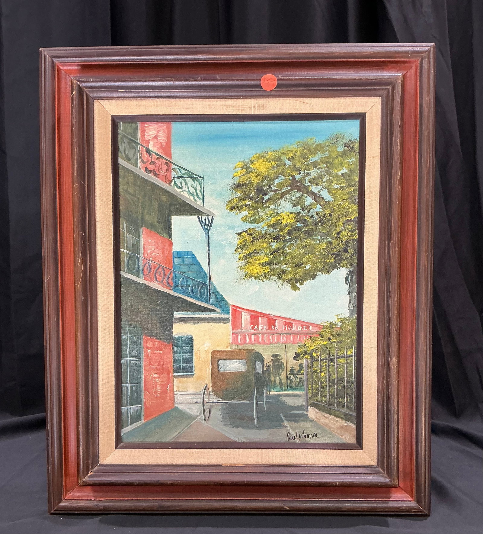 Paul Sampson Street Scene Painting: Original framed painting signed Paul Sampson depicting a colorful street scene with horse-drawn carriage, café frontage, and mature trees. Executed in a traditional style with strong decorative