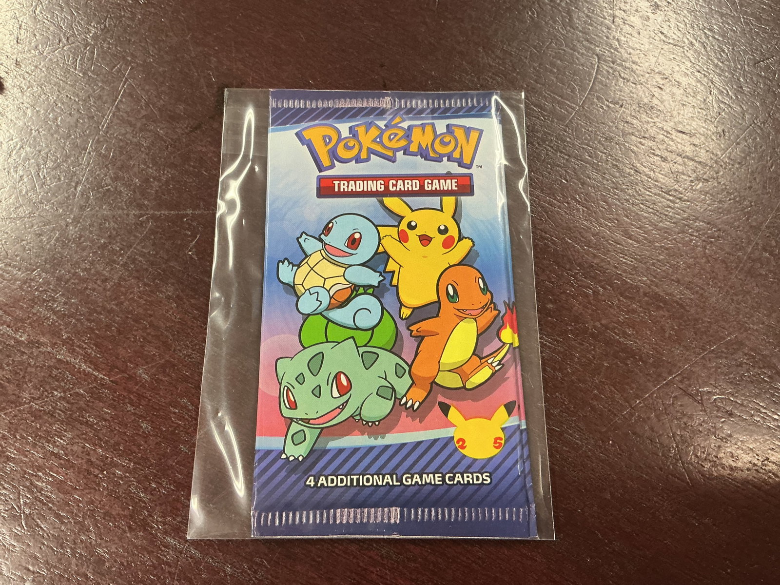 Celebrations Booster Pack: Factory sealed Pokemon Celebrations 25th Anniversary booster pack featuring classic starter artwork. A compact sealed collectible from the celebrated anniversary release, ideal for sealed Pokemon