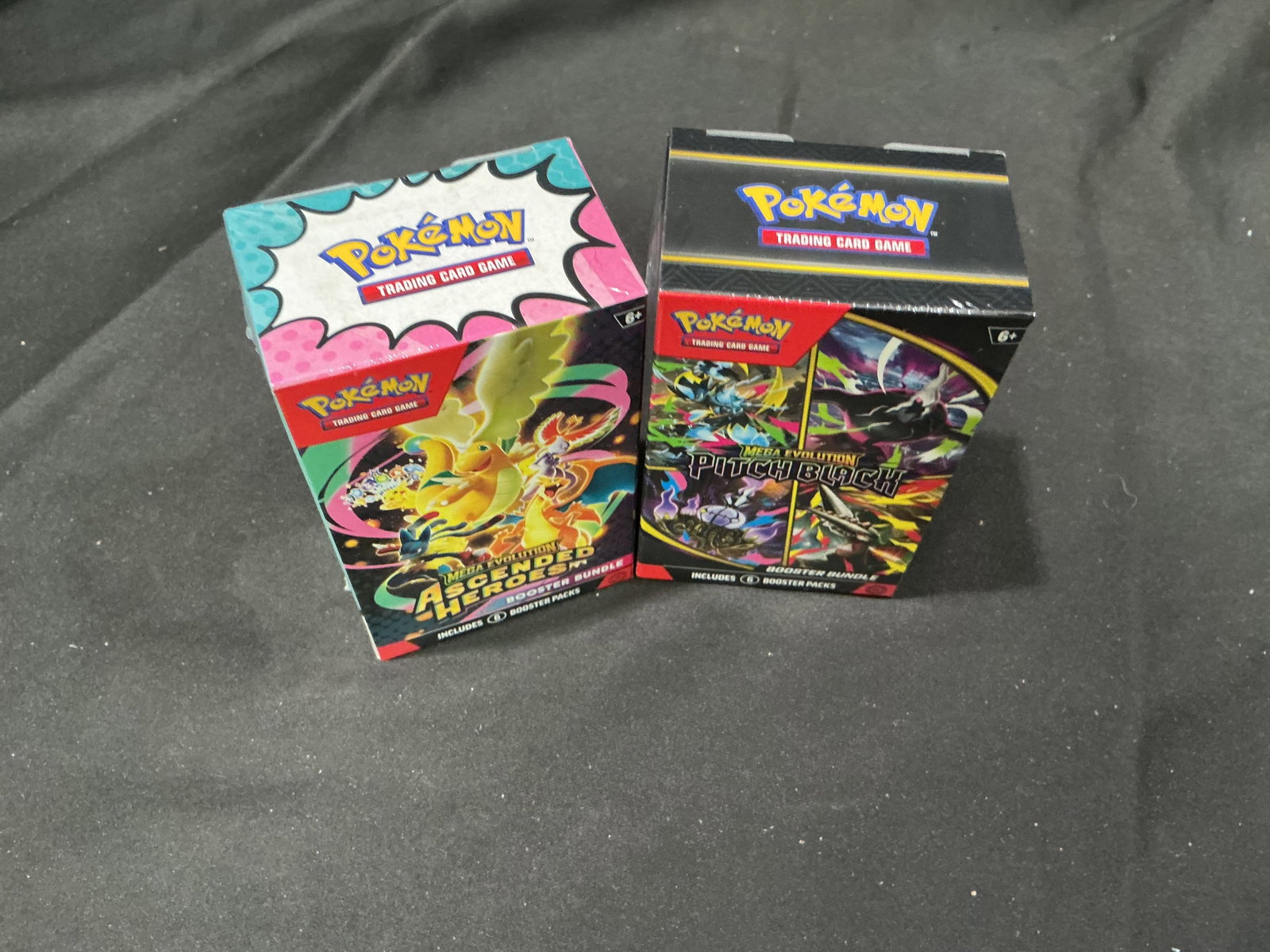 Ascended Heroes & Pitch Black Bundles: Back for another opportunity, this pairing combines one Ascended Heroes Booster Bundle with one Pitch Black Booster Bundle. Two Mega Evolution releases come together in a single sealed lot for