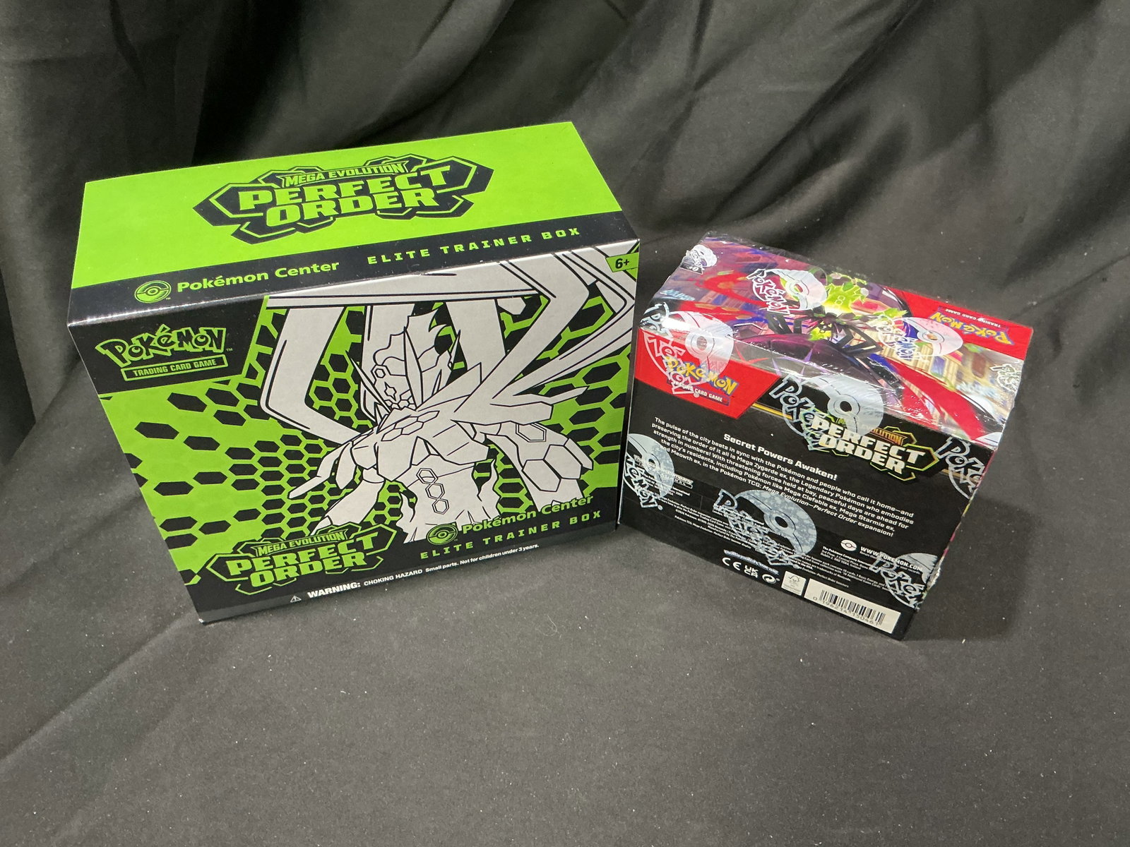 Perfect Order Center ETB & Booster Box: Back after previous bidder interest, this pairing features a factory sealed Pokemon Center Perfect Order Elite Trainer Box alongside a factory sealed Perfect Order Booster Box containing 30 booster pa