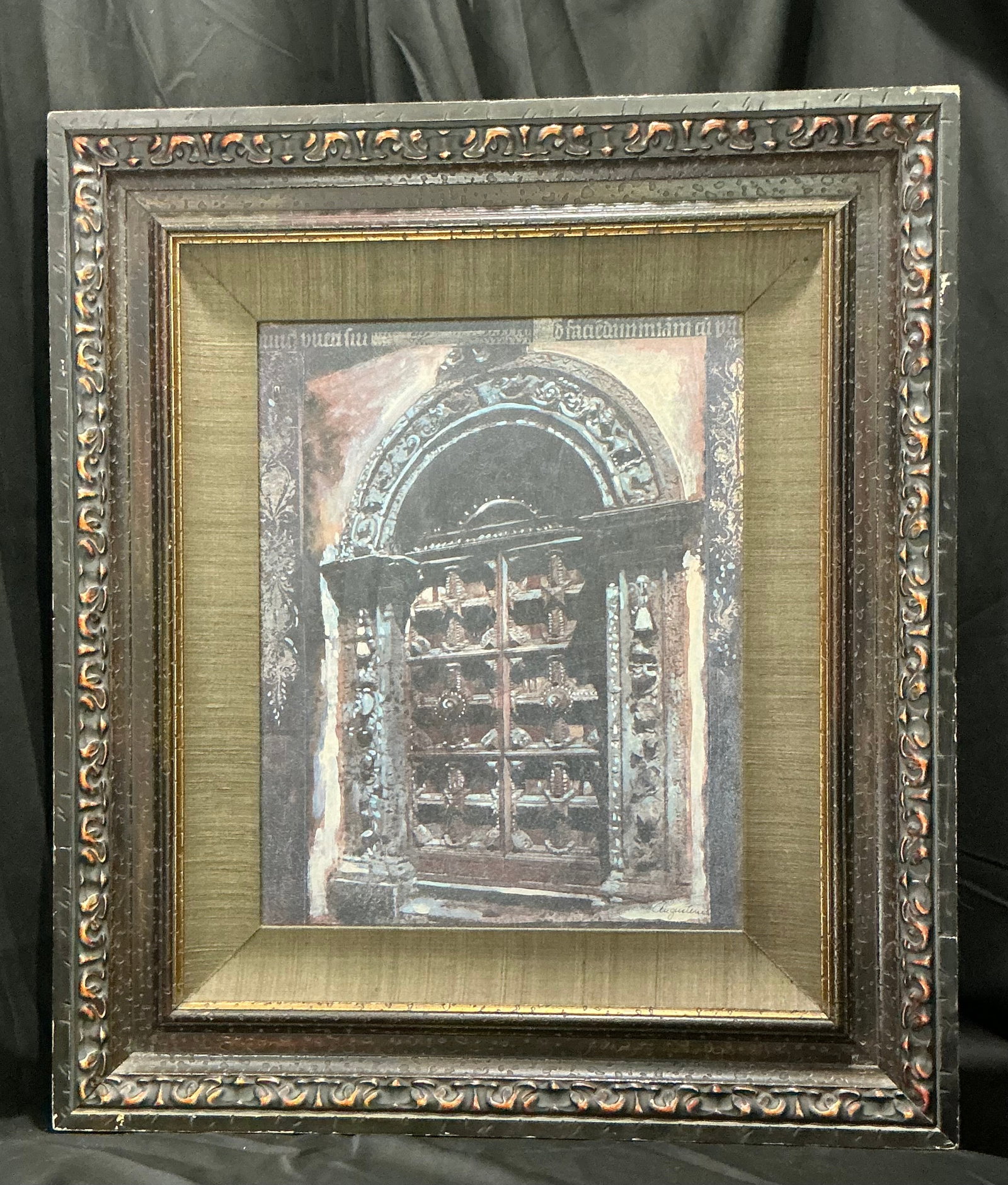 Signed Architectural Doorway Artwork II: A companion piece to the earlier architectural artwork, this signed framed composition depicts an ornate carved doorway with rich architectural details and warm, muted tones. Displayed in a