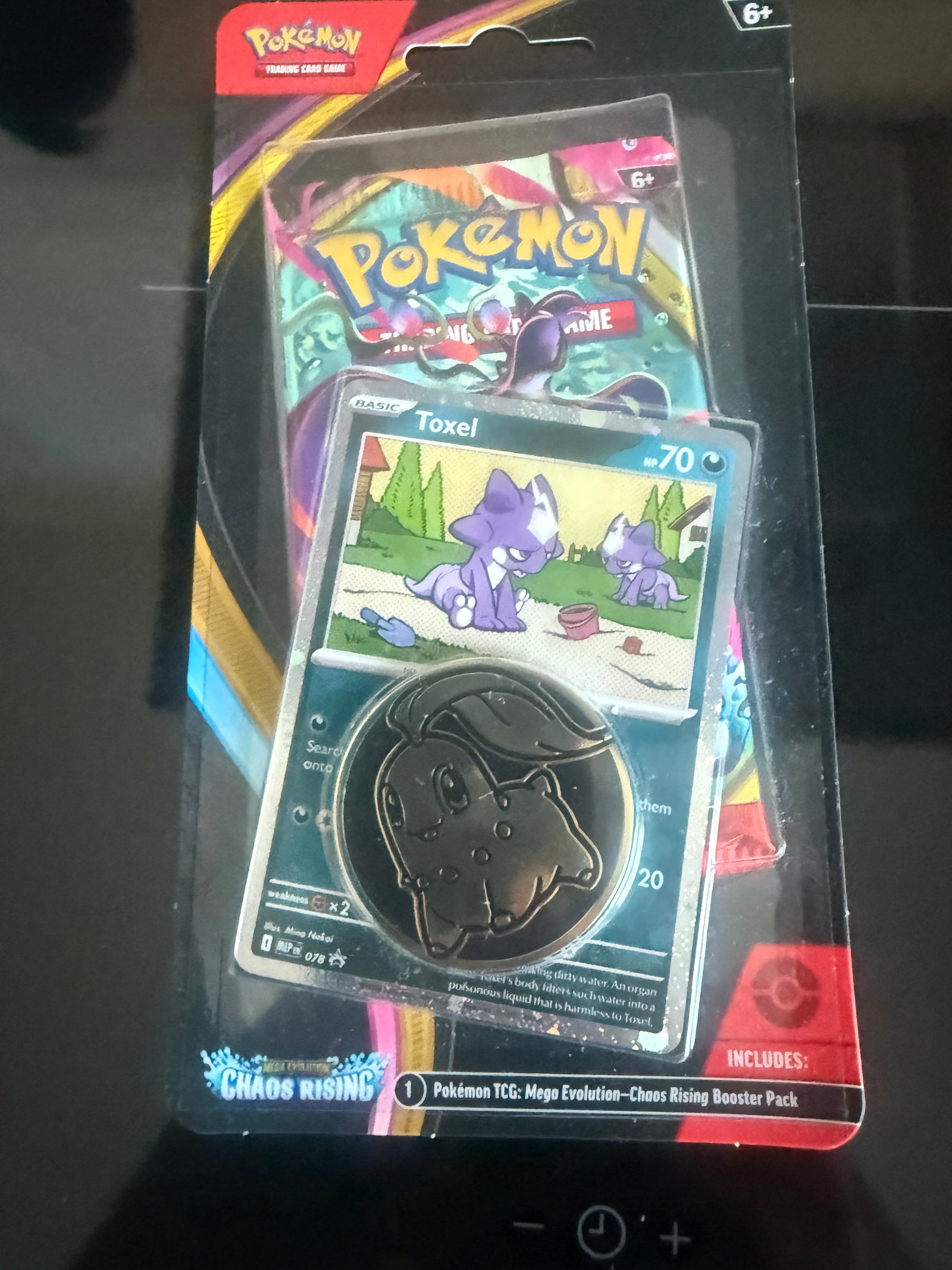 Chaos Rising Toxel Checklane Blister: Back again, this factory sealed Pokemon Mega Evolution Chaos Rising checklane blister includes one Chaos Rising booster pack, a Toxel promo card, and a collectible coin. An affordable sealed