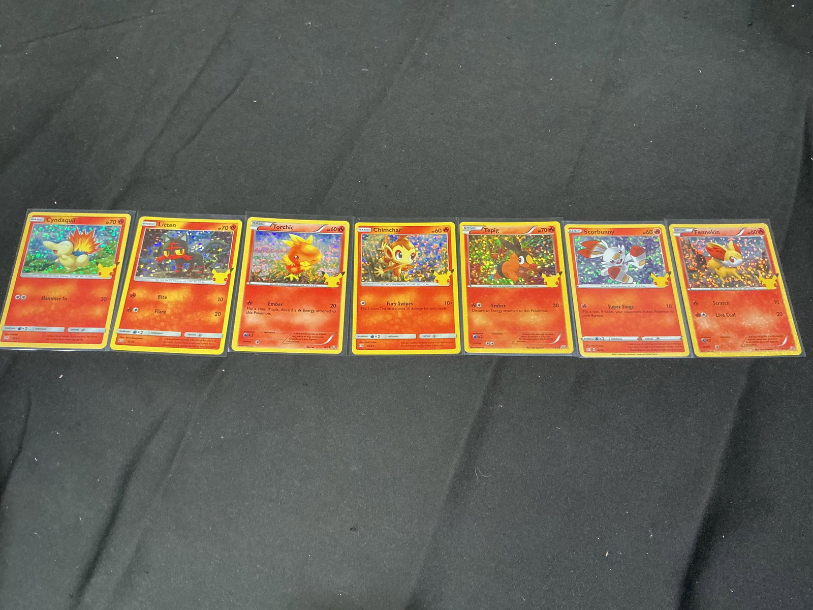 Pokemon Fire Starter Holo Card Set: Returning after prior appearances, this Pokemon McDonald's 25th Anniversary holographic starter collection features Cyndaquil, Litten, Torchic, Chimchar, Tepig, Scorbunny, and Fennekin. A colorful