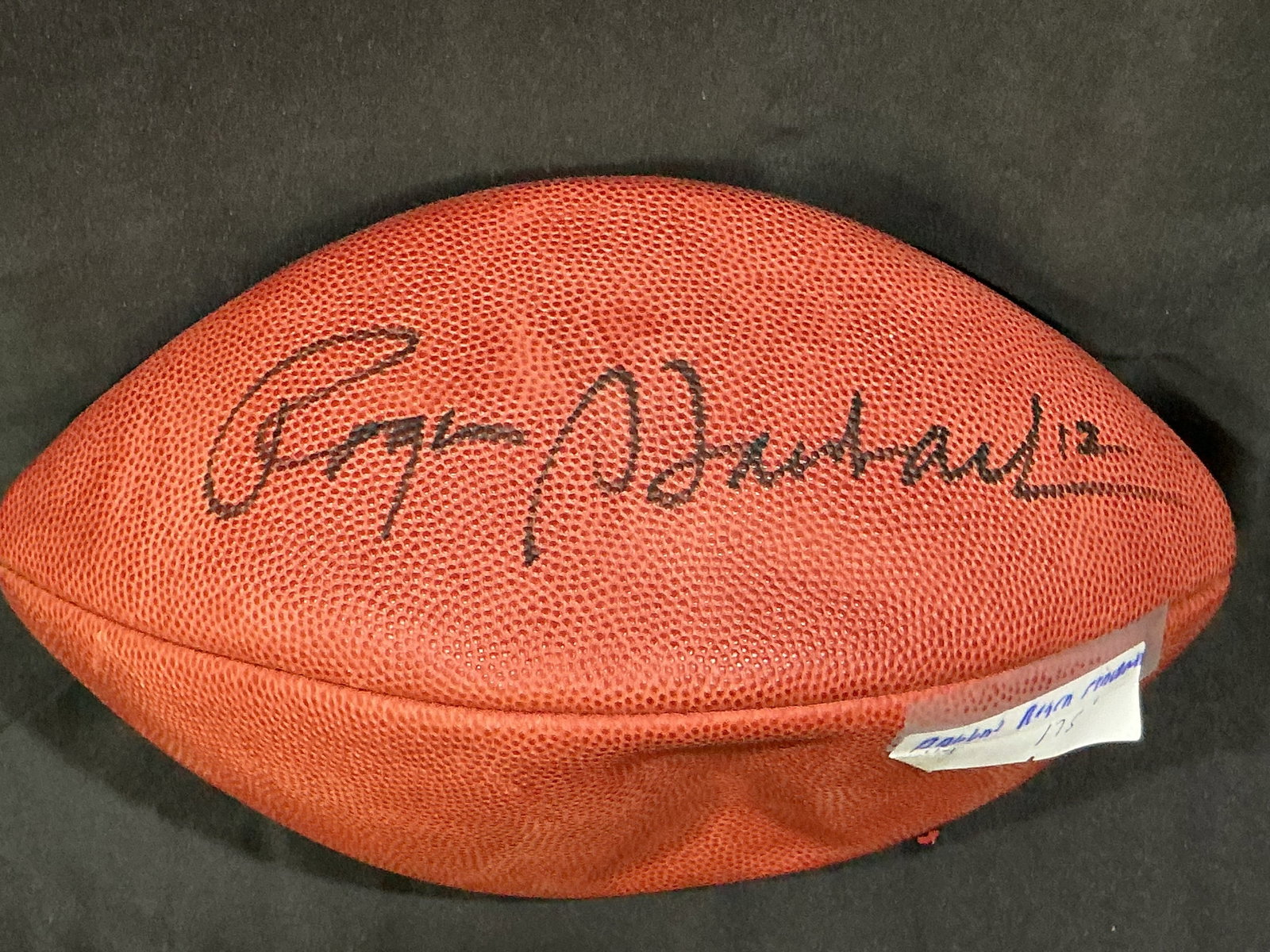Roger Staubach Signed NFL Football: Official Wilson NFL football personally hand-signed by Hall of Fame quarterback Roger Staubach (#12) of the Dallas Cowboys. A standout display piece for Cowboys fans and NFL memorabilia collectors