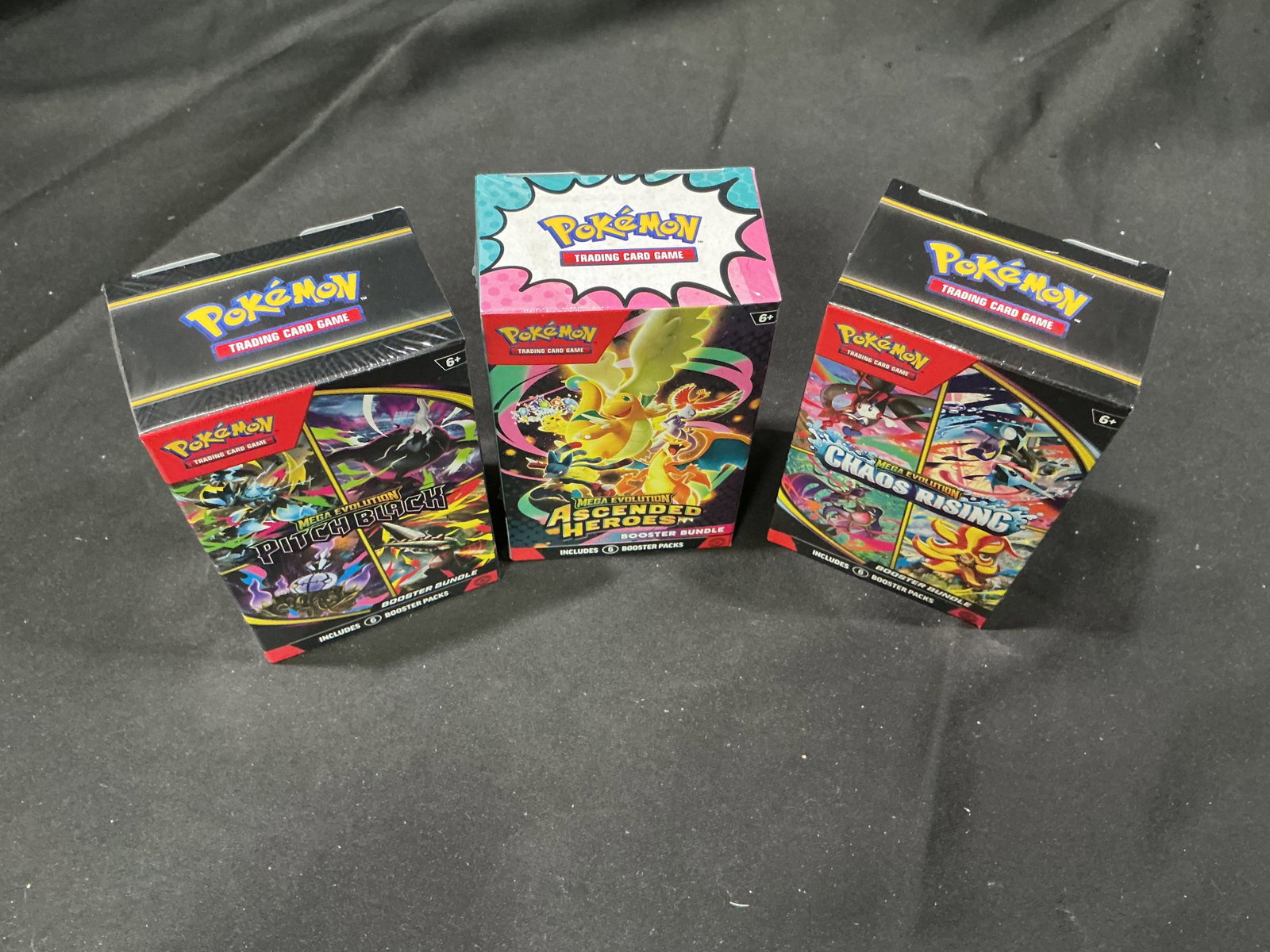 Pitch Black, Ascended Heroes & Chaos Rising Booster Bundles: Three factory sealed Pokemon Mega Evolution Booster Bundles featuring Pitch Black, Ascended Heroes, and Chaos Rising. Offering three distinct expansions in one lot, this trio provides excellent