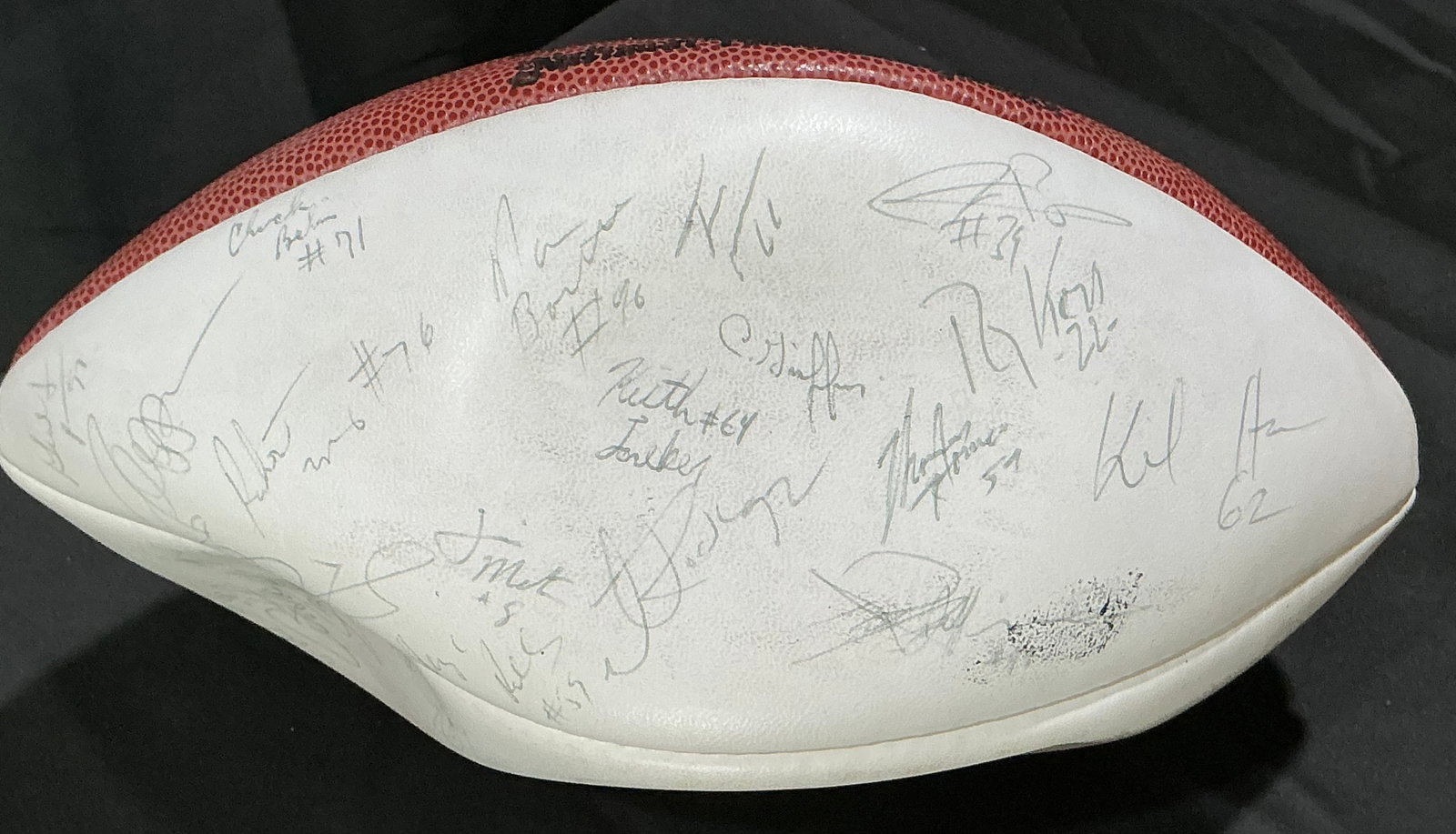 Franco Bowl Team-Signed Football: Wilson NFL football signed by approximately 25 or more players and coaches from the commemorative 'Franco Bowl.' Autographs in blue and black marker cover all panels, creating a distinctive display