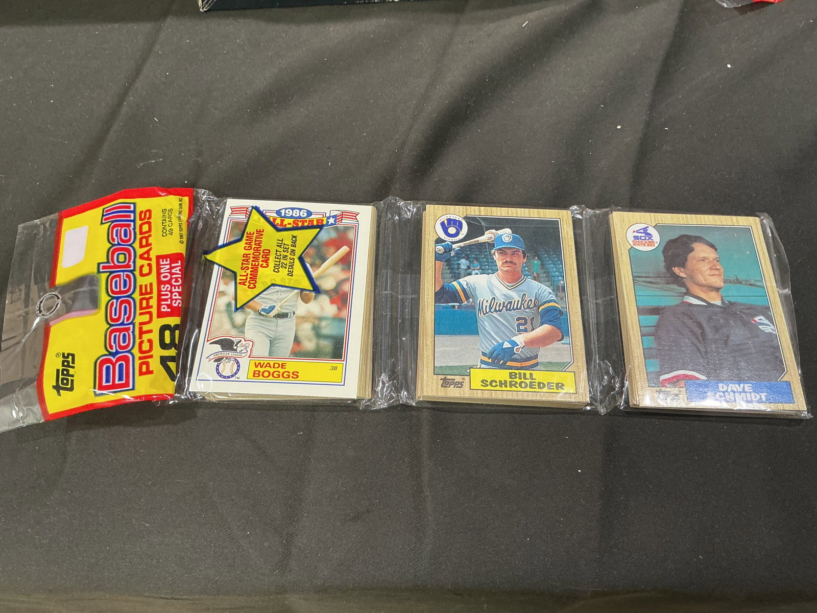 1986 Topps Baseball Cello Pack: Returning once again, this sealed 1986 Topps Baseball cello pack containing 48 picture cards plus one special card. Example players shown on the packaging include Wade Boggs, Bill Schroeder, and Dave