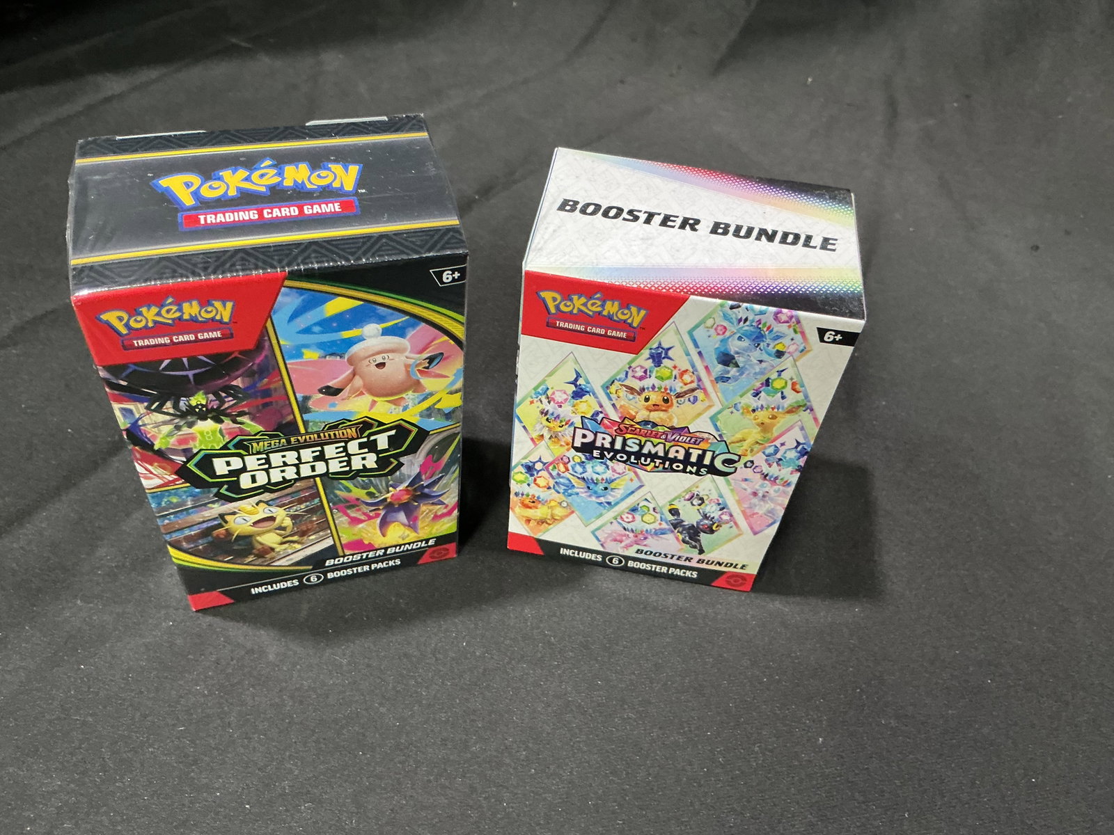 Perfect Order & Prismatic Evolutions Bundles: Featured again, this factory sealed pairing combines a Pokemon Mega Evolution Perfect Order Booster Bundle with a Pokemon Scarlet & Violet Prismatic Evolutions Booster Bundle. A proven combination