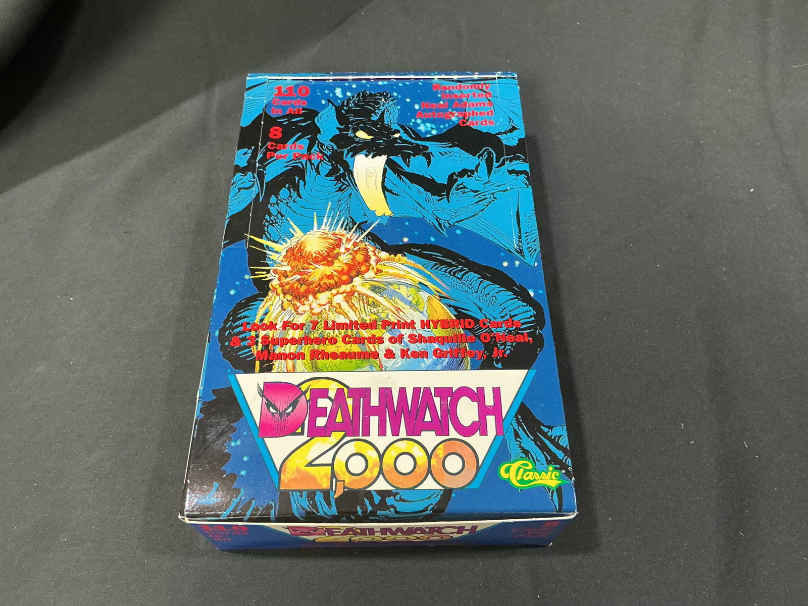Deathwatch 2000 Sealed Box: Returning for another appearance, this factory sealed Deathwatch 2000 trading card box by Classic contains 110 cards with 8 cards per pack. Look for randomly inserted Neal Adams autographed cards,