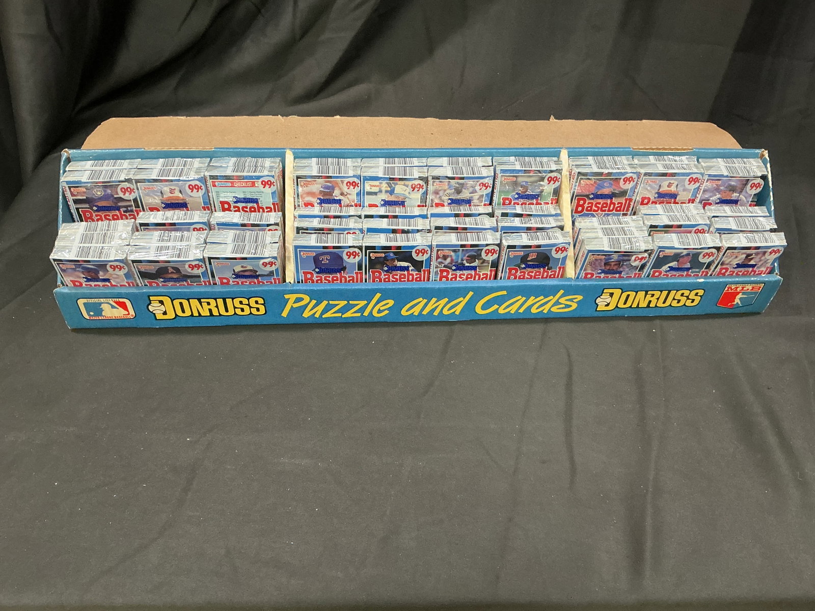 Donruss 50-Pack Display Tray 1988: Returning to our auctions, this original 1988 Donruss Baseball retail display tray contains 50 sealed Puzzle and Cards packs featuring Stan Musial puzzle pieces and baseball cards. We have additional