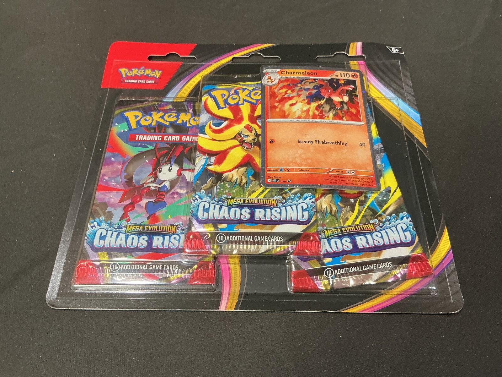Chaos Rising Charmeleon 3-Pack Blister: A popular return from earlier in our auctions, this factory sealed Pokemon Mega Evolution Chaos Rising three-pack blister includes three Chaos Rising booster packs and an exclusive Charmeleon foil