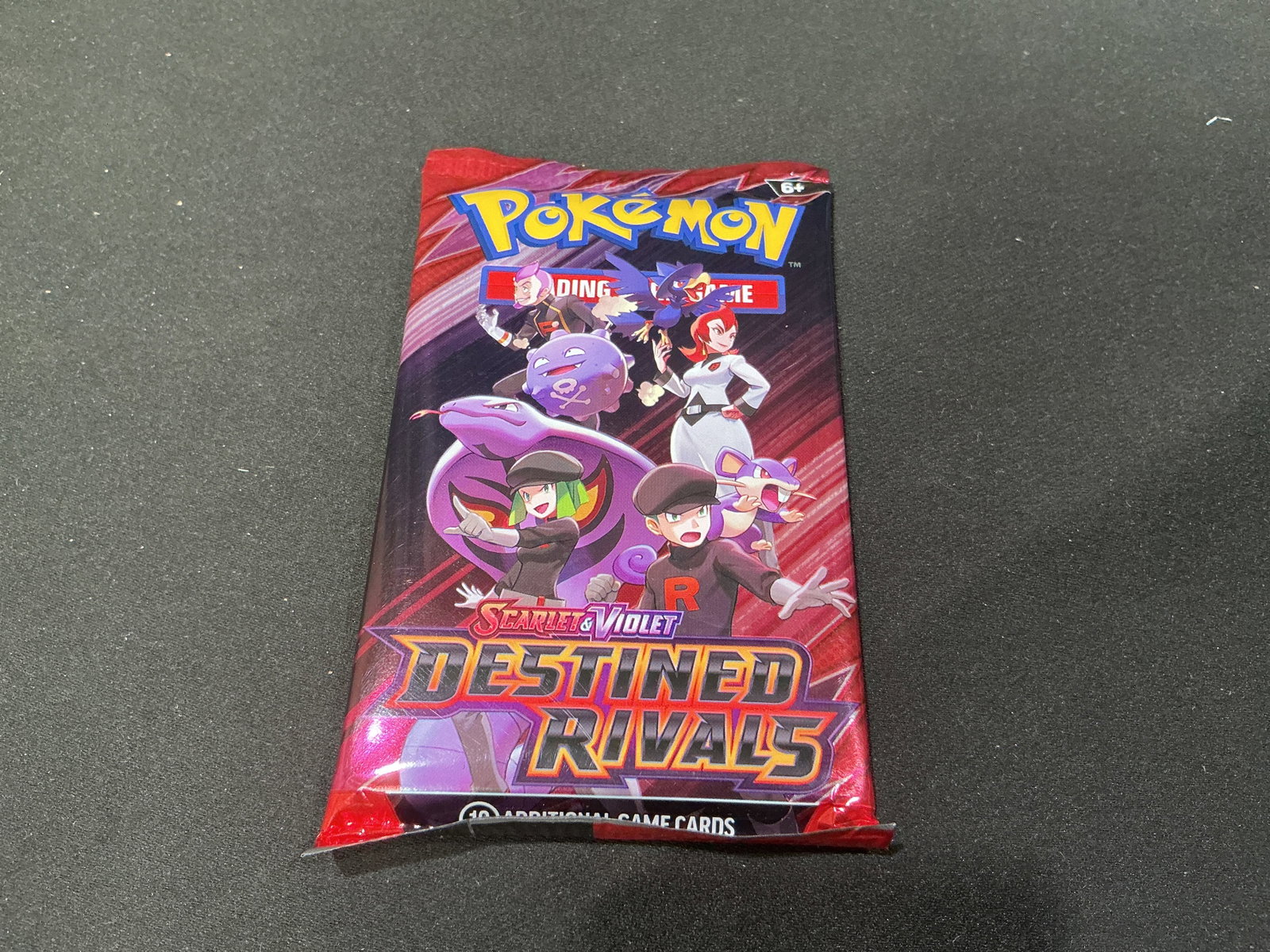 Scarlet and Violet Destined Rivals Booster Pack: Featuring Team Rocket-themed artwork, this factory sealed Pokemon Scarlet & Violet Destined Rivals booster pack returns for another opportunity. An affordable way to add a sealed modern Pokemon pack