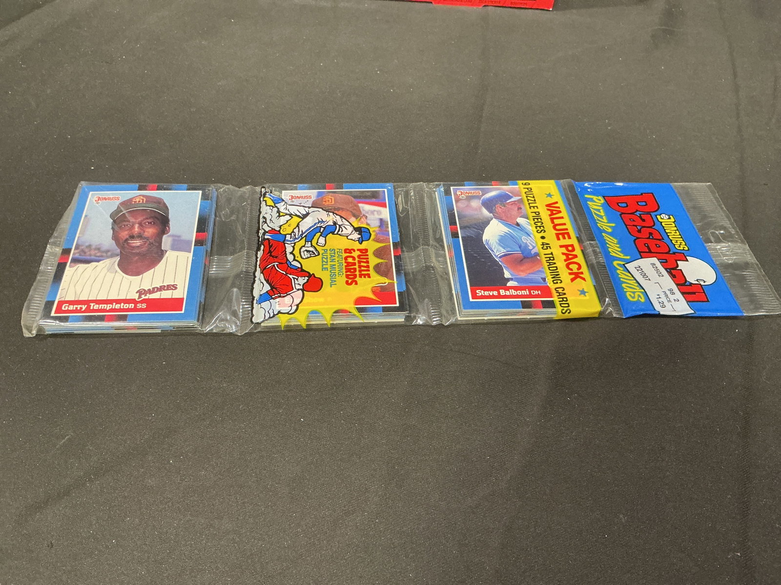 1988 Donruss Baseball Value Pack: Factory sealed 1988 Donruss Baseball Value Pack featuring Garry Templeton and Steve Balboni on the visible cards. This oversized value pack contains 45 trading cards plus 9 puzzle pieces, offering a l