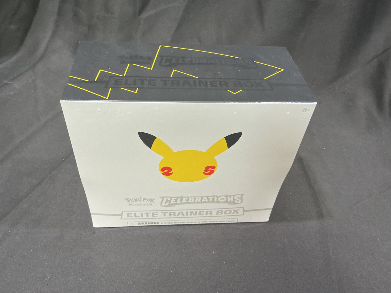 Celebrations Pokemon Elite Trainer Box: Appearing again after its previous offering, this factory sealed Pokemon Celebrations Elite Trainer Box commemorates the 25th Anniversary of the Pokemon Trading Card Game. Includes Celebrations