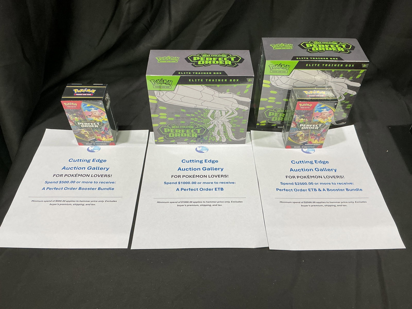 Perfect Order Spend & Receive Free Pokemon: Featured again for this auction, this promotional display outlines Cutting Edge Auction Gallery's spend-and-receive offers for Pokemon buyers. Spend $500 to receive a Perfect Order Booster Bundle,