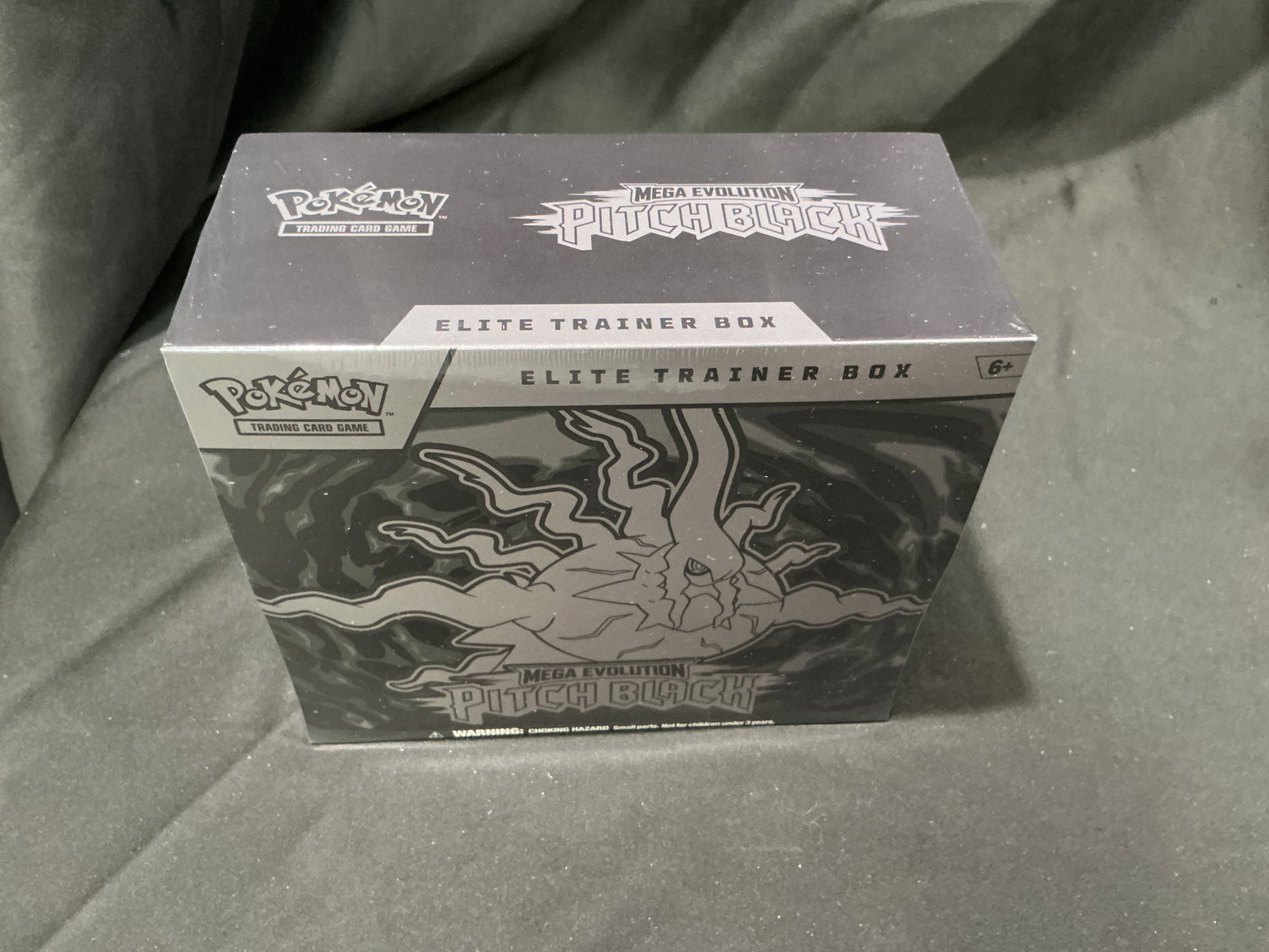 Pokemon Pitch Black ETB Sealed: Offered once more, this factory sealed Pokemon Mega Evolution Pitch Black Elite Trainer Box highlights the dark-themed release with nine booster packs, a full-art Zeraora promo card, card sleeves,