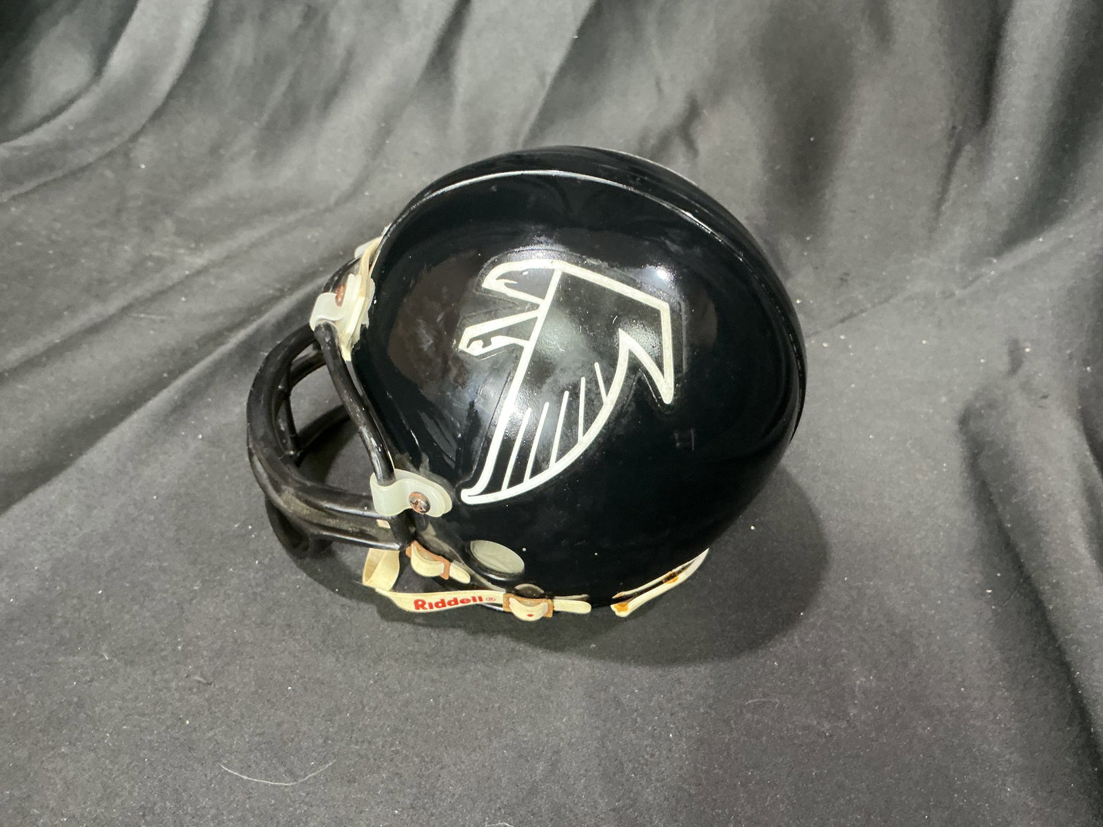 Atlanta Falcons Mini Riddell Helmet: Making another appearance, this Atlanta Falcons mini display helmet by Riddell features the team logo and retains its original factory tags. A compact NFL collectible suited for Falcons fans,