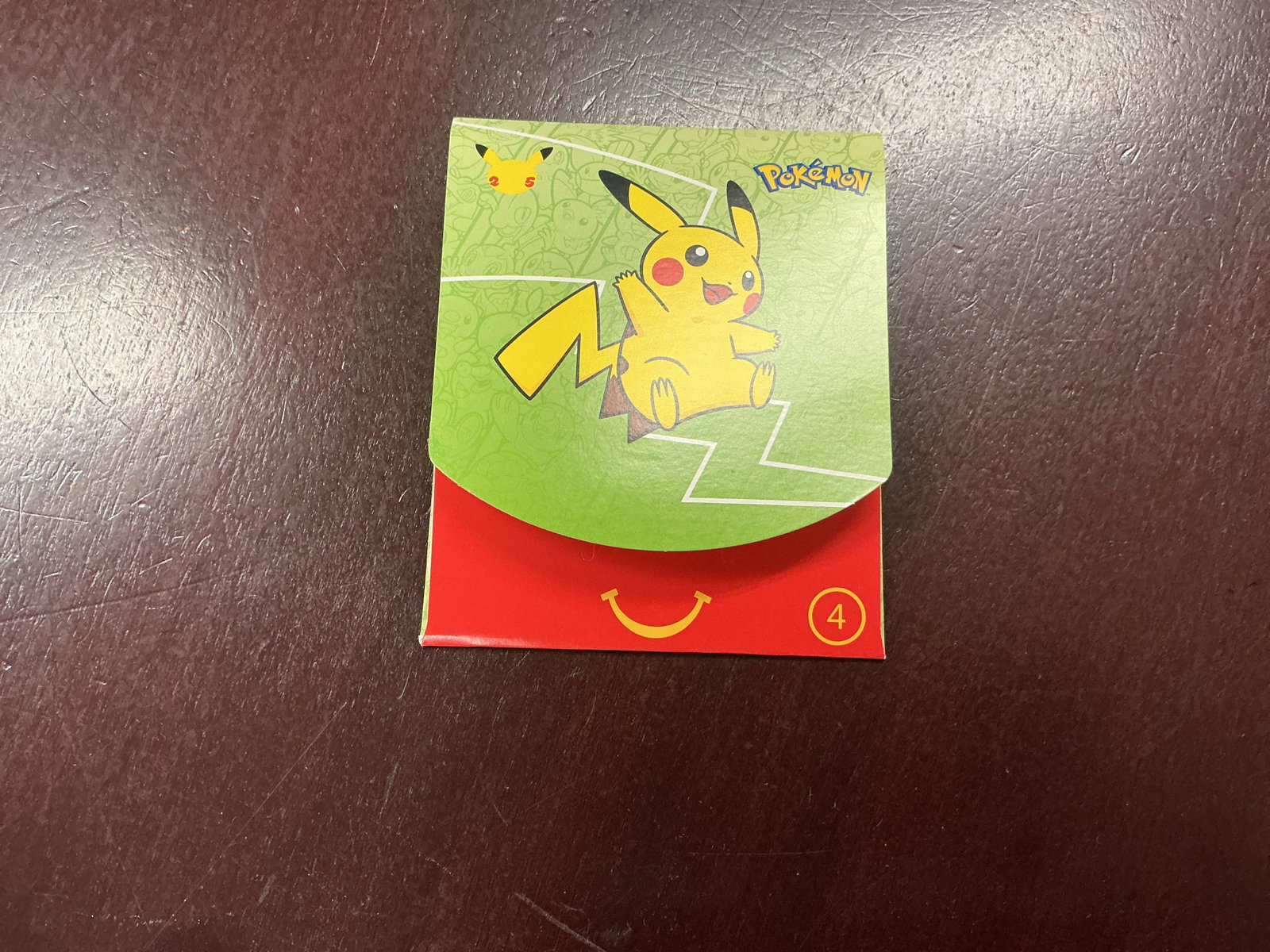 Green Pokemon Pikachu Happy Meal Box: Back for another opportunity, this green Pokemon McDonald's Pikachu Happy Meal collectible box features bright Pikachu-themed graphics and includes a factory sealed pack containing four McDonald's