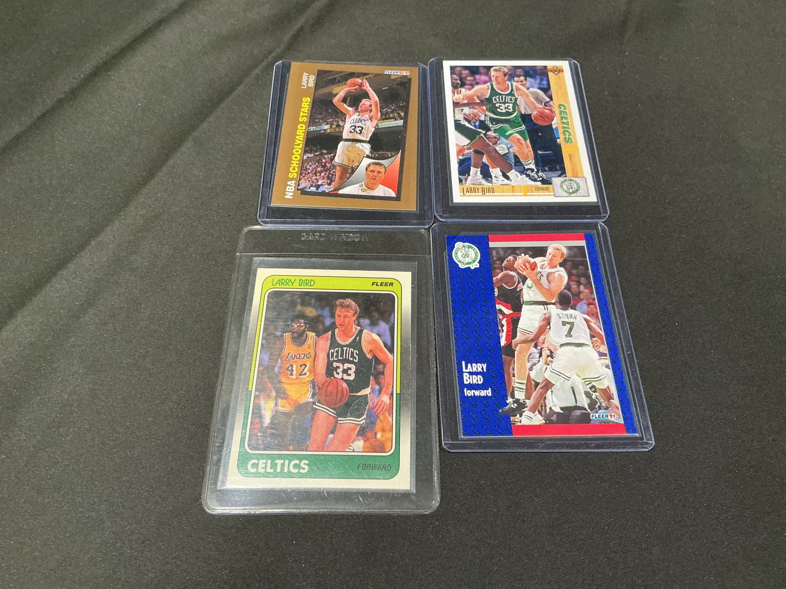 Larry Bird Basketball Card Group Including Fleer and Upper Deck: Returning for another opportunity, this group of four Larry Bird basketball cards includes Fleer and Upper Deck issues spanning multiple eras. Centered on the Boston Celtics legend and Hall of Famer,