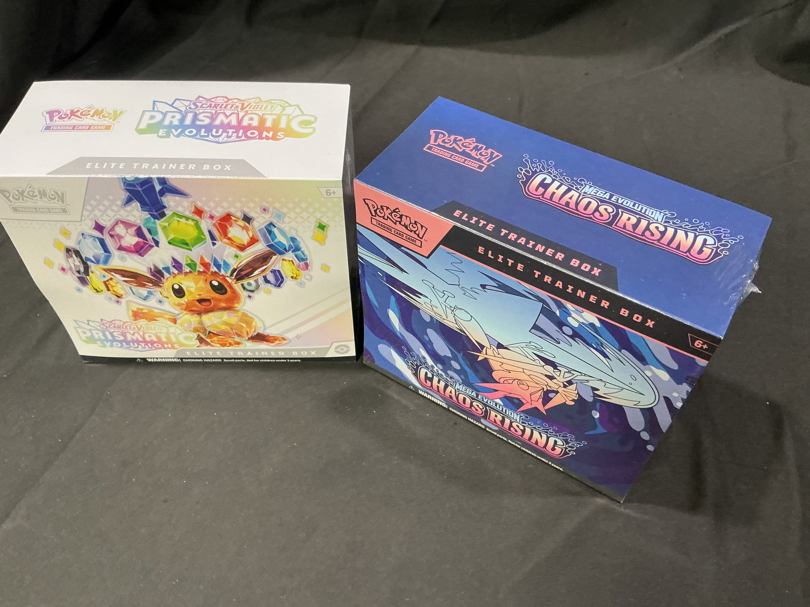 Prismatic Evolutions & Chaos Rising ETBs: Offered together once more, this factory sealed pairing includes one Pokemon Scarlet & Violet Prismatic Evolutions Elite Trainer Box and one Pokemon Mega Evolution Chaos Rising Elite Trainer Box.