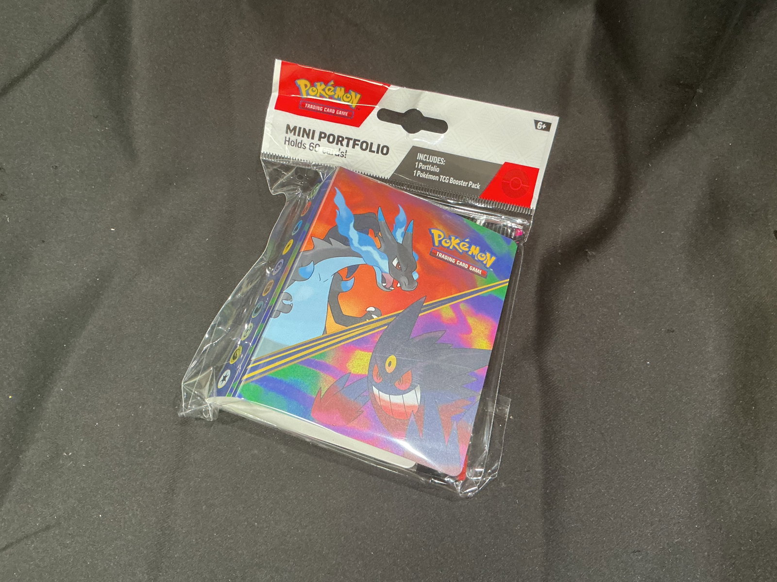Phantasmal Flames Mini Portfolio: Returning for another opportunity, this sealed Pokemon Mega Evolution Phantasmal Flames Mini Portfolio includes a themed mini card portfolio paired with a matching Phantasmal Flames booster pack.