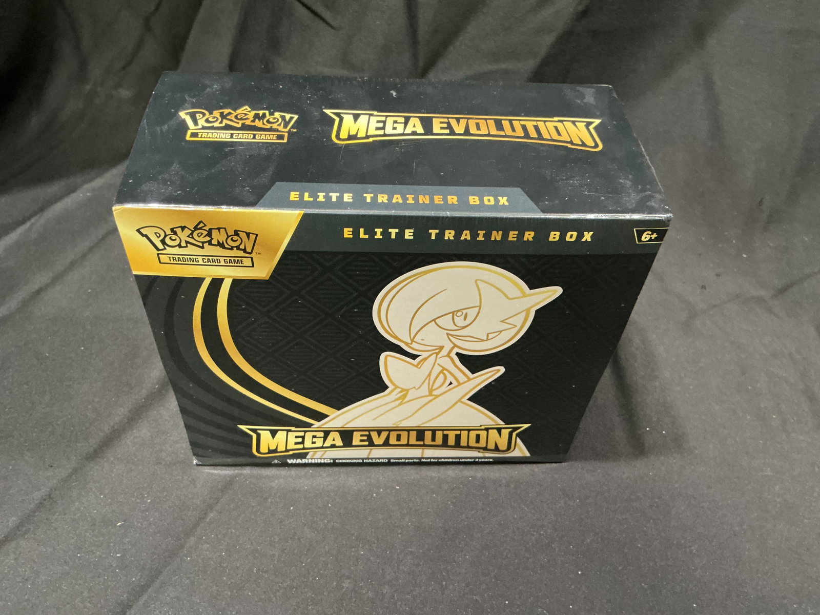 Mega Gardevoir ETB Sealed: Offered again for sealed Pokemon collectors, this factory sealed Pokemon Mega Evolution Elite Trainer Box features Gardevoir artwork and includes booster packs, sleeves, dice, and collector