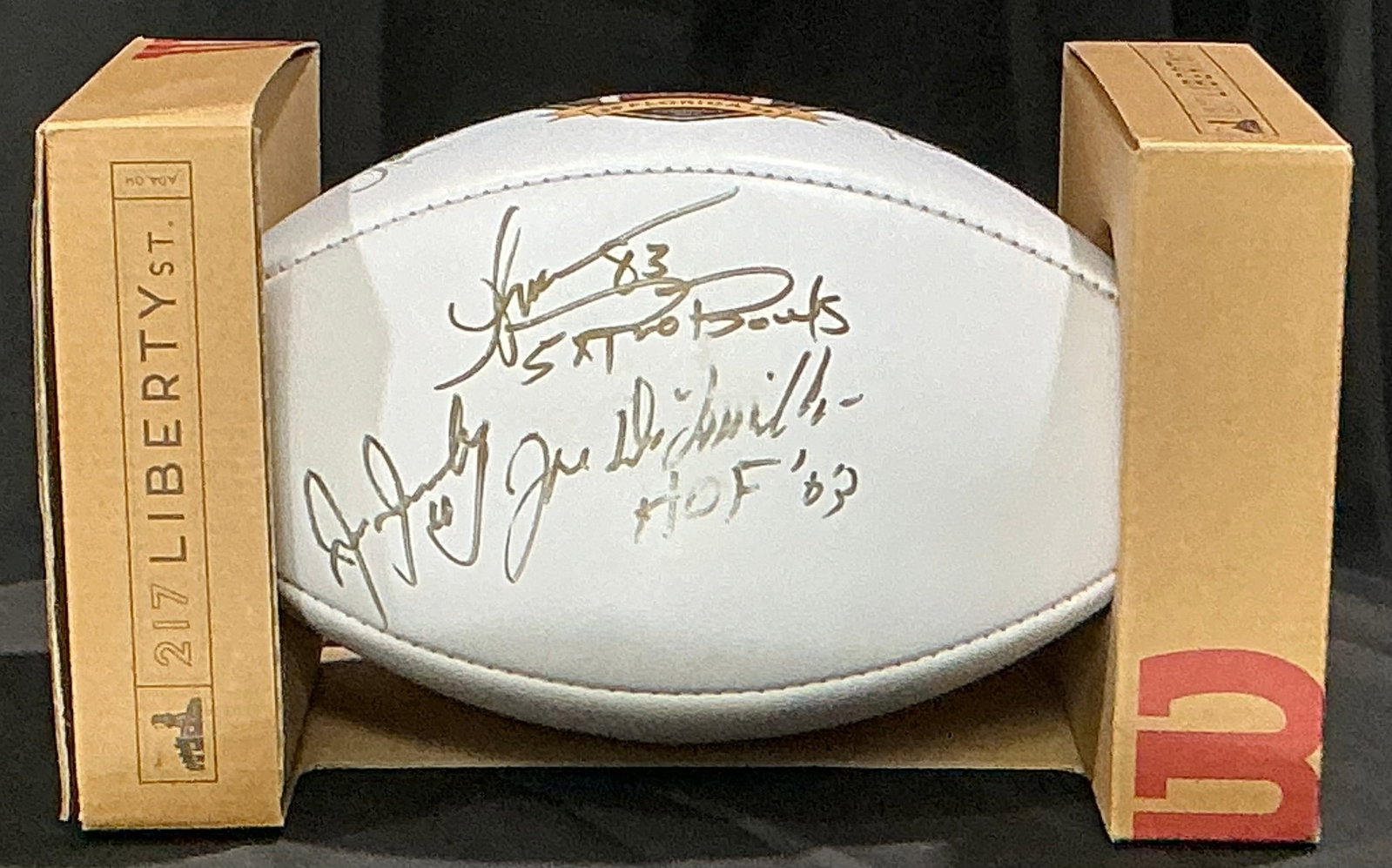 Triple-Signed Hula Bowl 2022 Football: Featured again, this official Hula Bowl Orlando 2022 commemorative football is signed by Hall of Famer Joe DeLamielleure and two additional participants in gold marker. Presented in its original