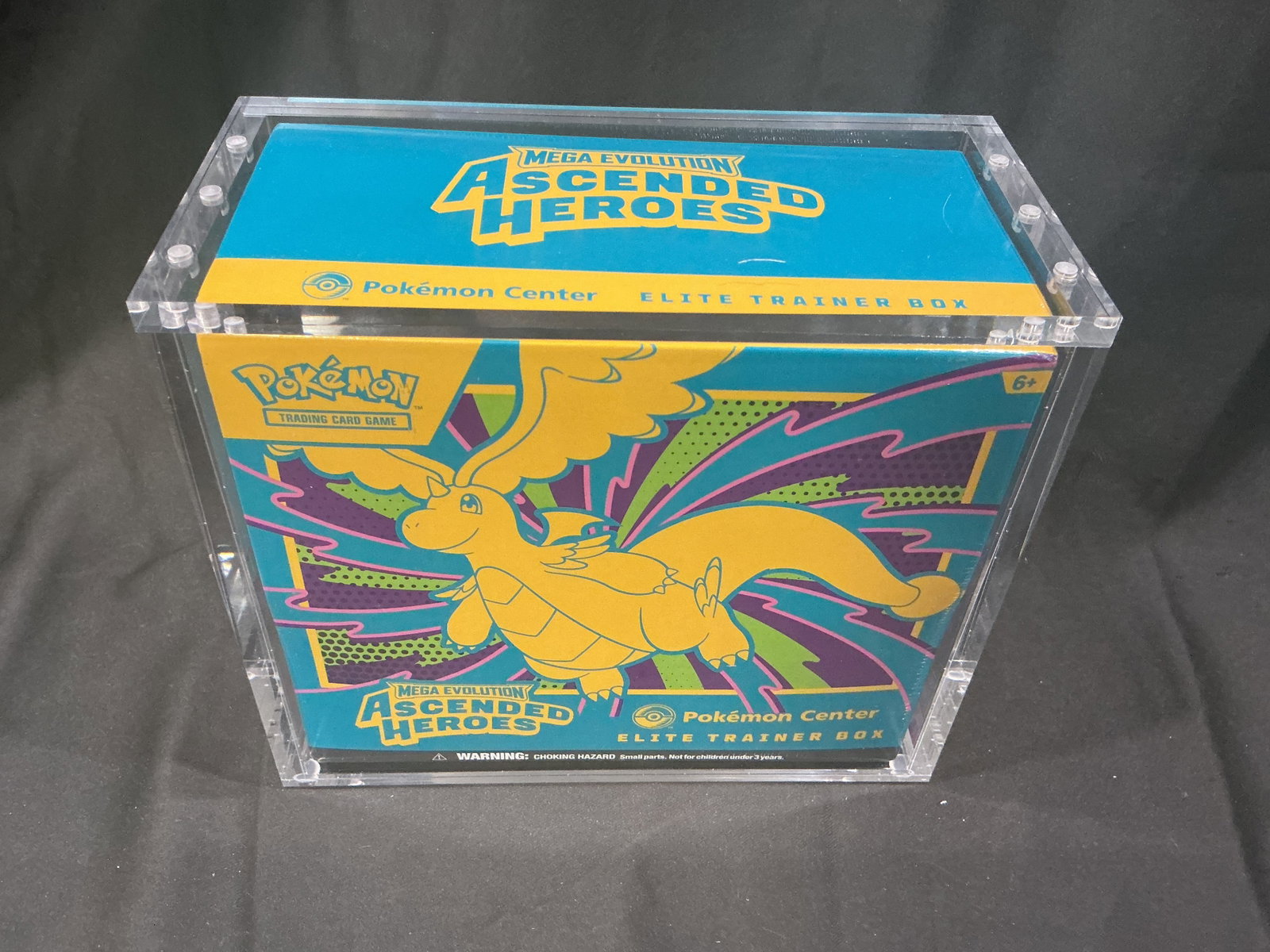 Center Ascended Heroes Pokemon ETB: Featured again, this factory sealed Pokemon Center Mega Evolution Ascended Heroes Elite Trainer Box is offered with the acrylic display case shown included in the sale. This is the only example being