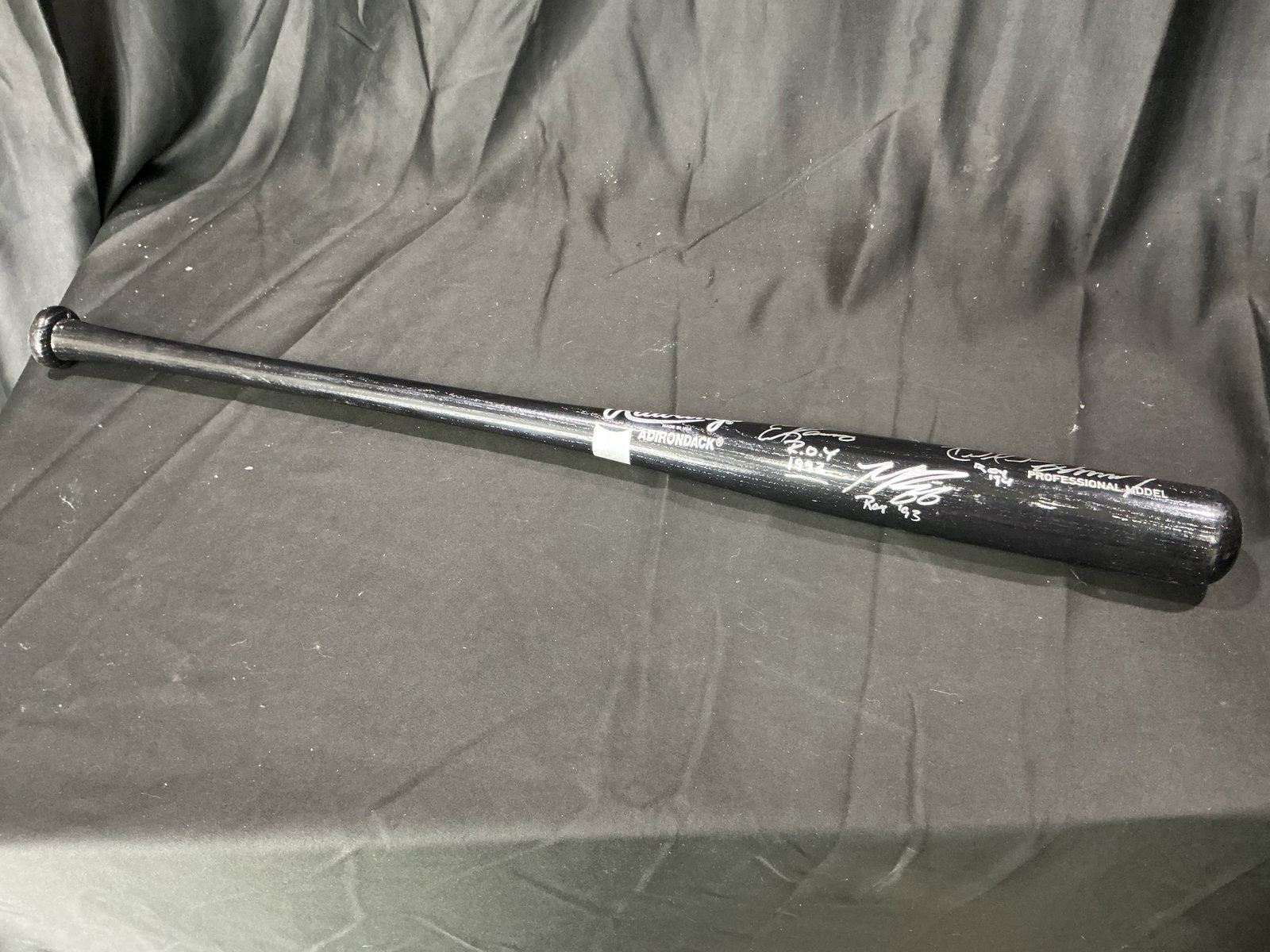 Multi-Signed Louisville Slugger Baseball Bat – Hall of Fame Players: Returning to the lineup, this Louisville Slugger wooden baseball bat bears multiple player autographs in marker. Visible signatures include Don Mattingly, Wade Boggs, Nolan Ryan, Ernie Banks, and othe