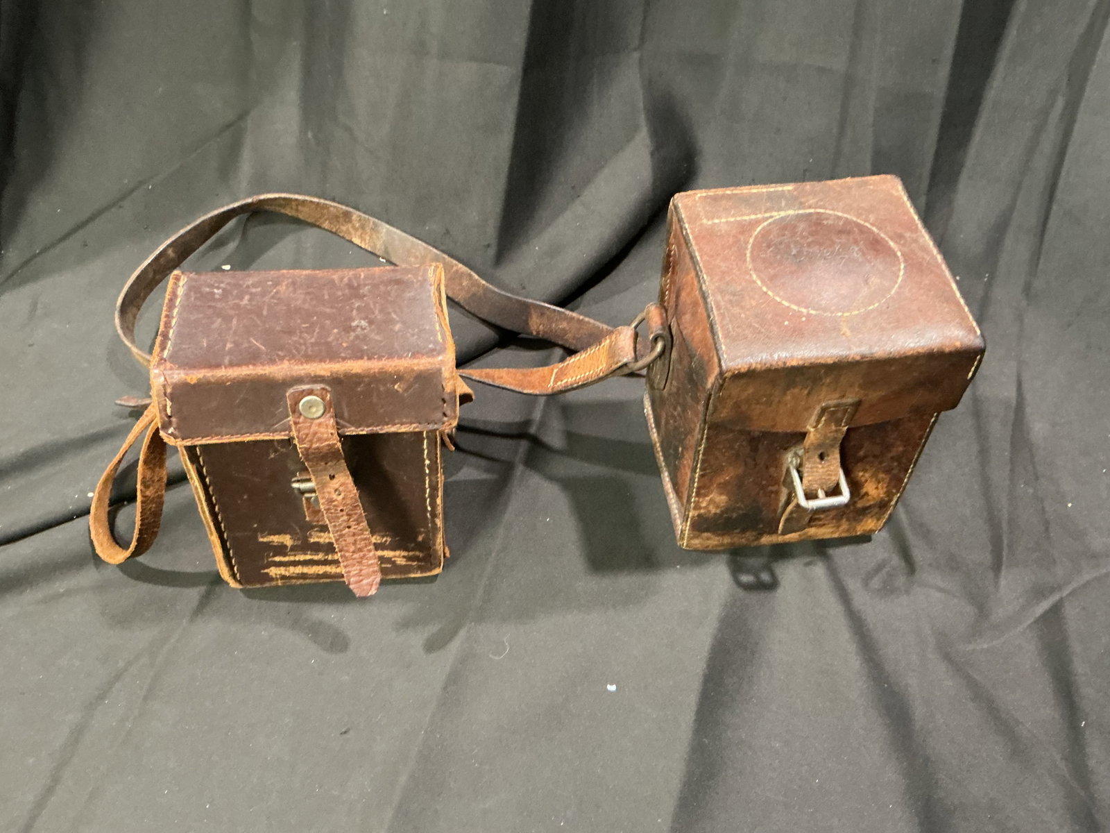 WWII Era Swedish Leather Pouches Pair: Making another appearance, this pair of vintage World War II-era Swedish leather pouches includes shoulder straps and fitted interiors with substantial age and character throughout. One is a