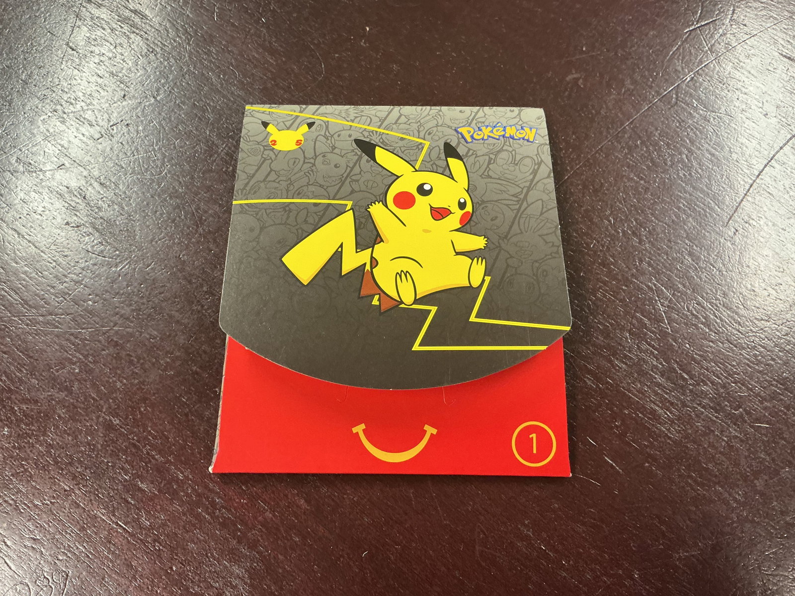 Grey Pokemon Pikachu McDonald's Happy Meal Box #1: Making another appearance, this Pokemon McDonald's Pikachu Happy Meal collectible box features bright Pikachu-themed graphics and includes a factory sealed pack containing four McDonald's 25th