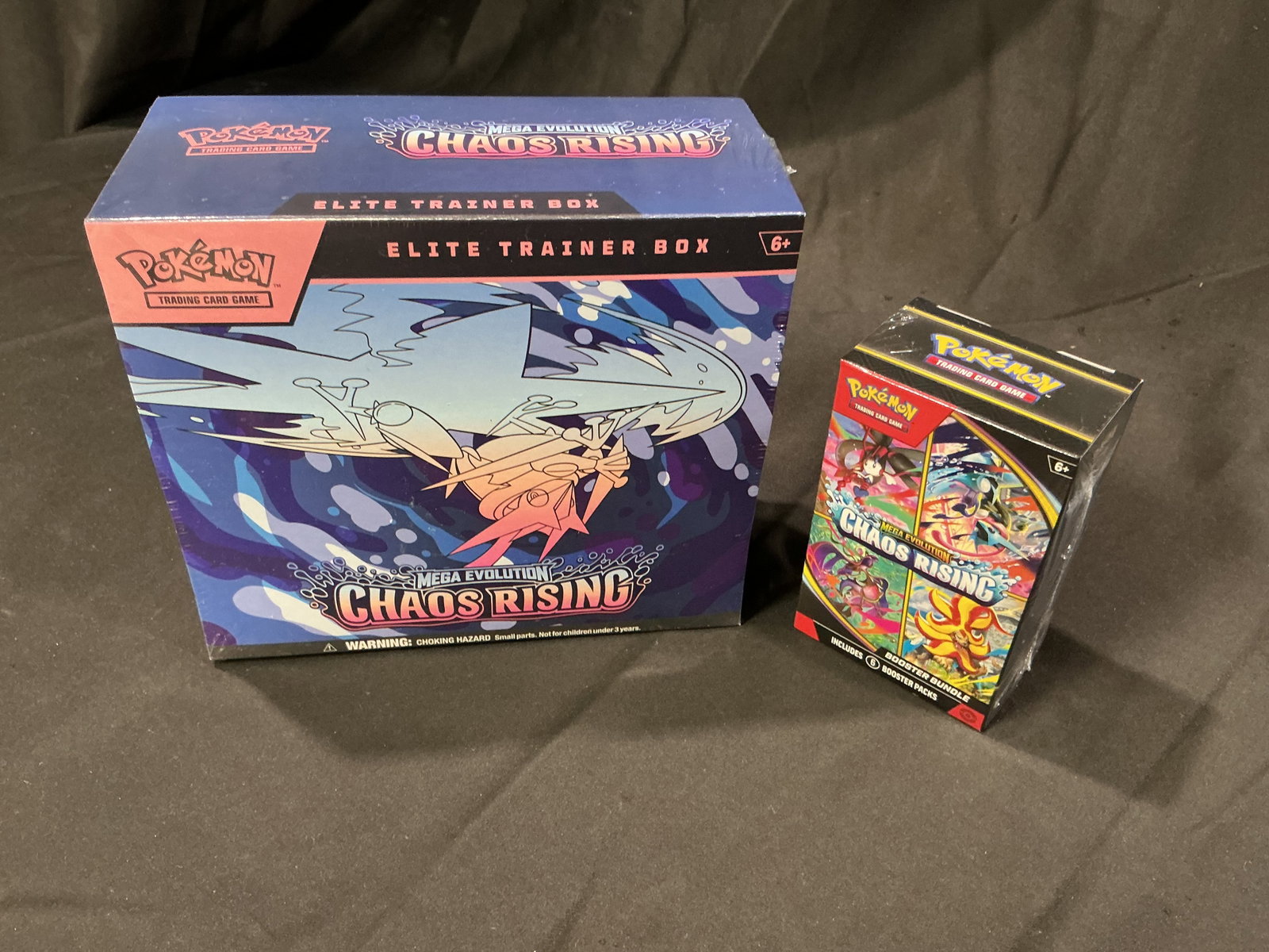 Pokemon Chaos Rising ETB & Booster Bundle Pair: Back together for another opportunity, this sealed Pokemon Mega Evolution Chaos Rising pairing includes one Elite Trainer Box and one matching Chaos Rising Booster Bundle. Combining the larger ETB