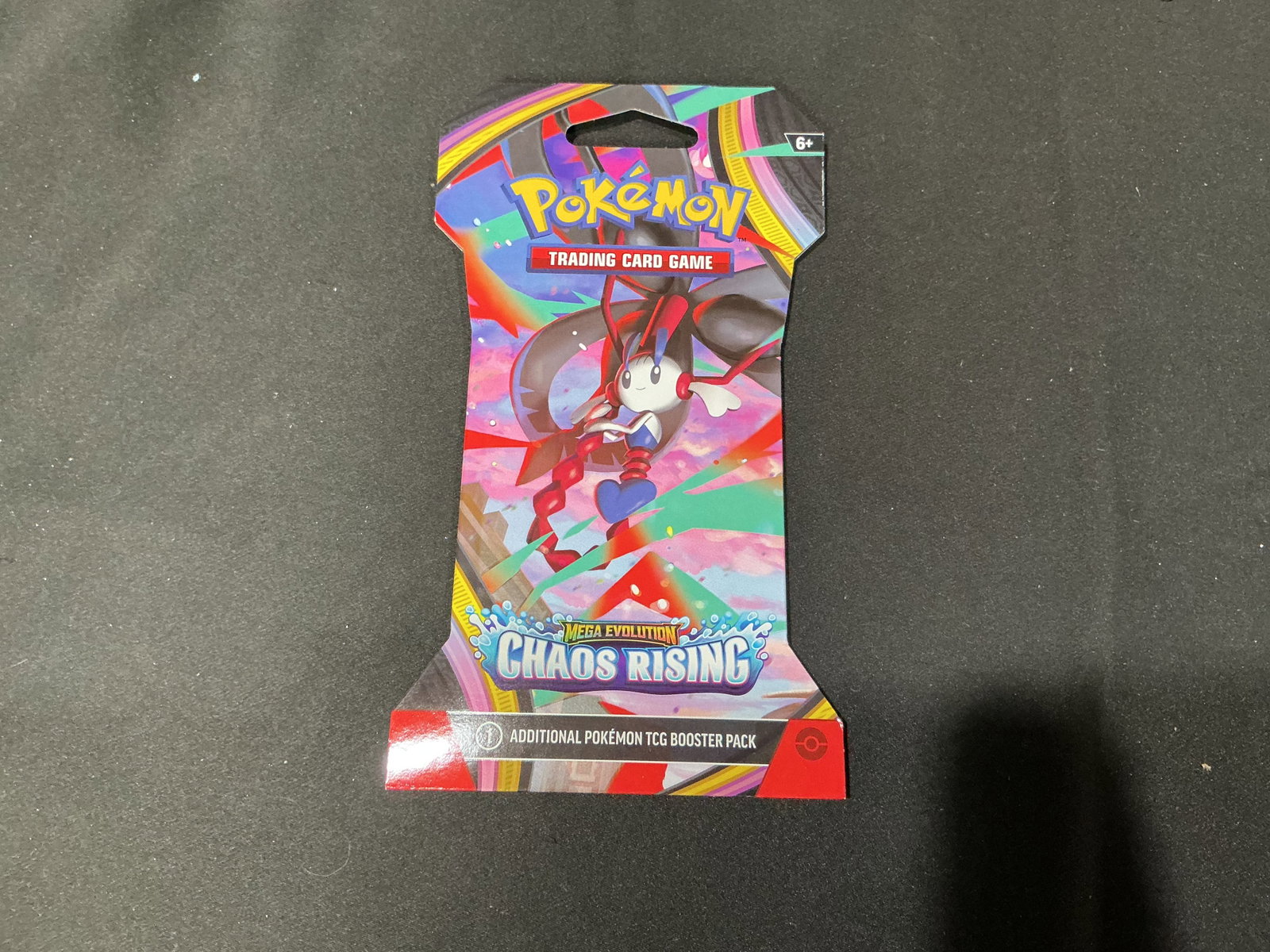 Pokemon Chaos Rising Booster Pack Blister Mega Floette ex: A factory sealed Pokemon Mega Evolution Chaos Rising sleeved booster pack featuring colorful promotional artwork on the outer cardboard packaging. Contains one Pokemon TCG Chaos Rising booster pack, o