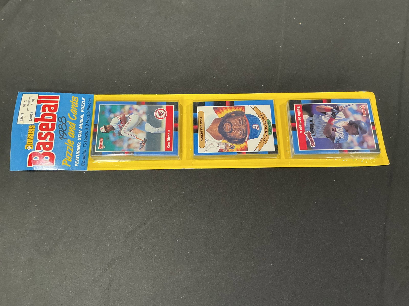 1988 Donruss Baseball 75-Card Rack Pack: Vintage 1988 Donruss Baseball rack pack containing 75 cards plus nine Stan Musial puzzle pieces in the original three-section retail packaging. Visible cards include Ken Dixon, Ivan Calderon Diamond