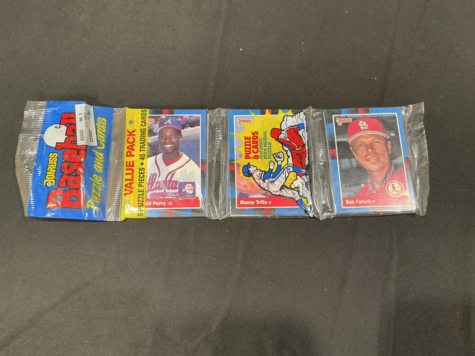 1988 Donruss Baseball Puzzle & Cards Value Pack: Vintage 1988 Donruss Baseball Puzzle and Cards value pack containing 9 puzzle pieces and 45 trading cards. The visible card sections feature Gerald Perry of the Atlanta Braves, Manny Trillo, and Bob