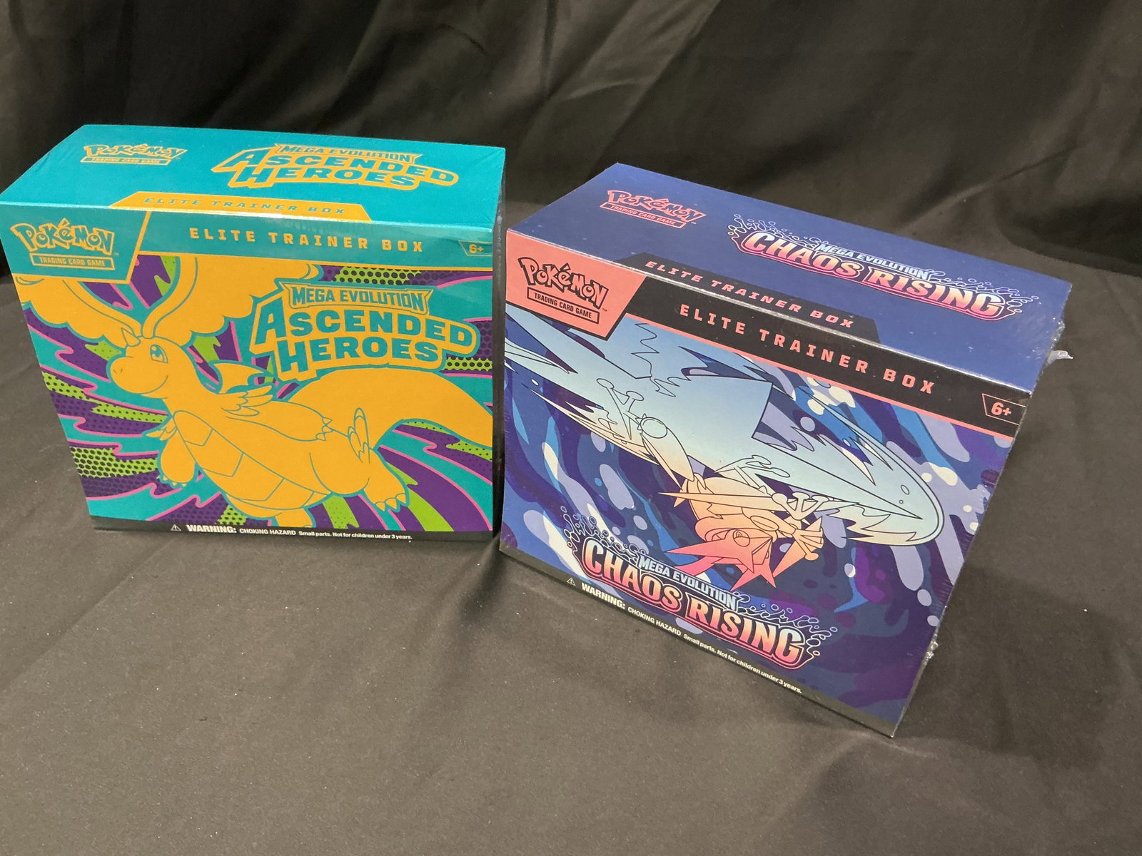 Ascended Heroes & Chaos Rising ETB Pair: Paired together once more, this factory sealed Pokemon Mega Evolution lot includes one Ascended Heroes Elite Trainer Box and one Chaos Rising Elite Trainer Box. Combining two popular Mega Evolution
