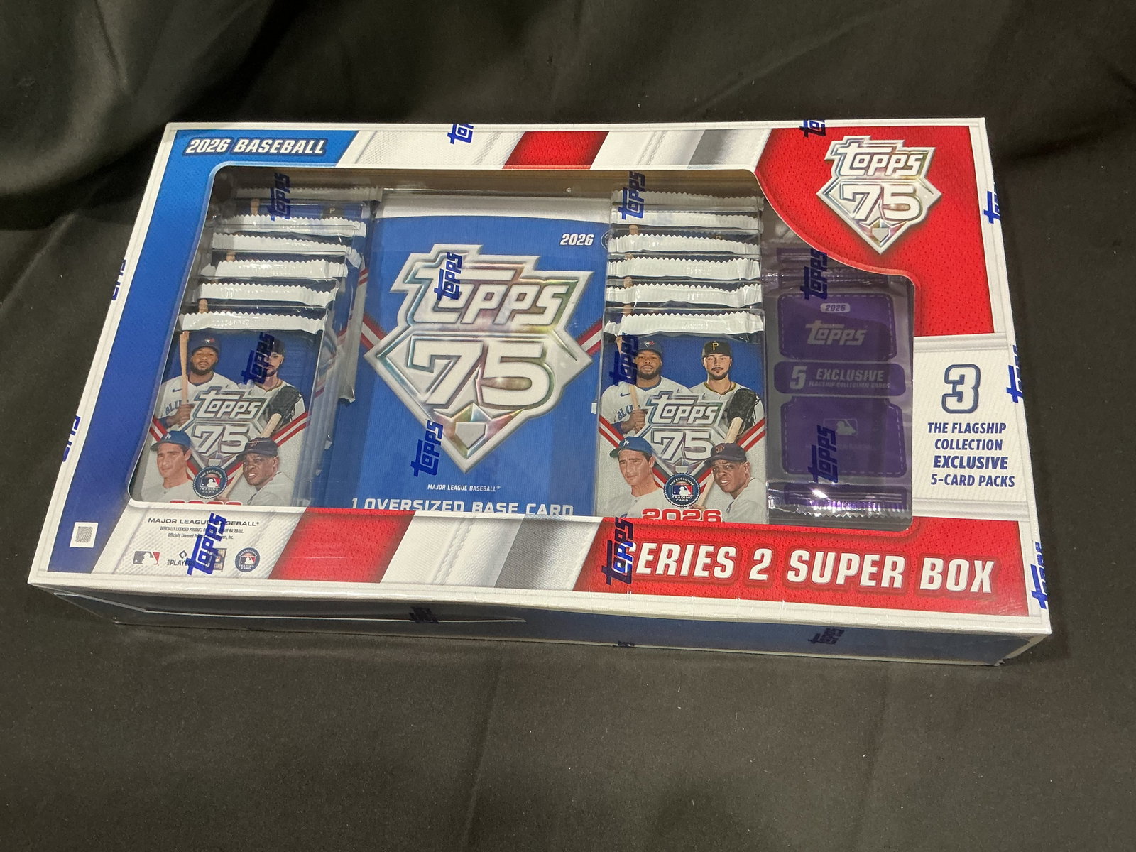 Topps 2026 Series 2 Baseball Super Box: Offered once more, this factory sealed 2026 Topps Baseball Series 2 Super Box celebrates the 75th anniversary of Topps Baseball. Includes twelve 14-card Series 2 packs, three exclusive Flagship