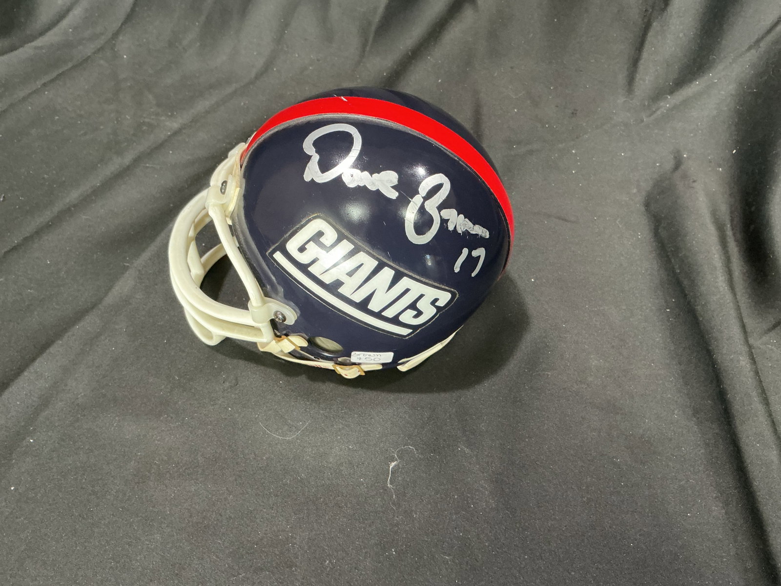 Dave Brown Signed NY Giants Mini Helmet: Offered again for football collectors, this Riddell New York Giants mini display helmet features the Giants wordmark logo, a vintage-style shell with red center stripe, and classic facemask